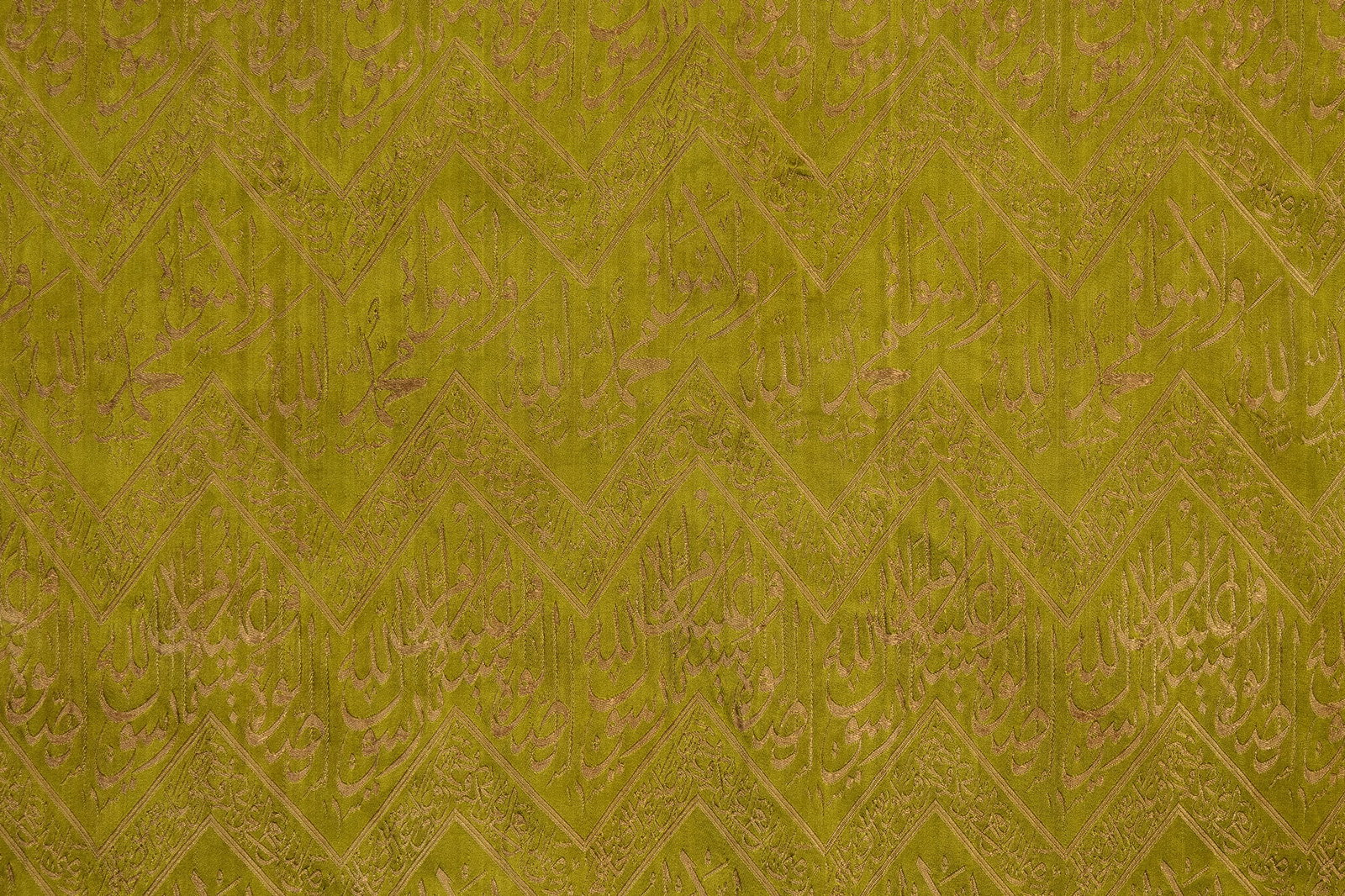 AN OTTOMAN CALLIGRAPHIC GREEN SILK LAMPAS TEXTILE PANEL. (1 of 3)