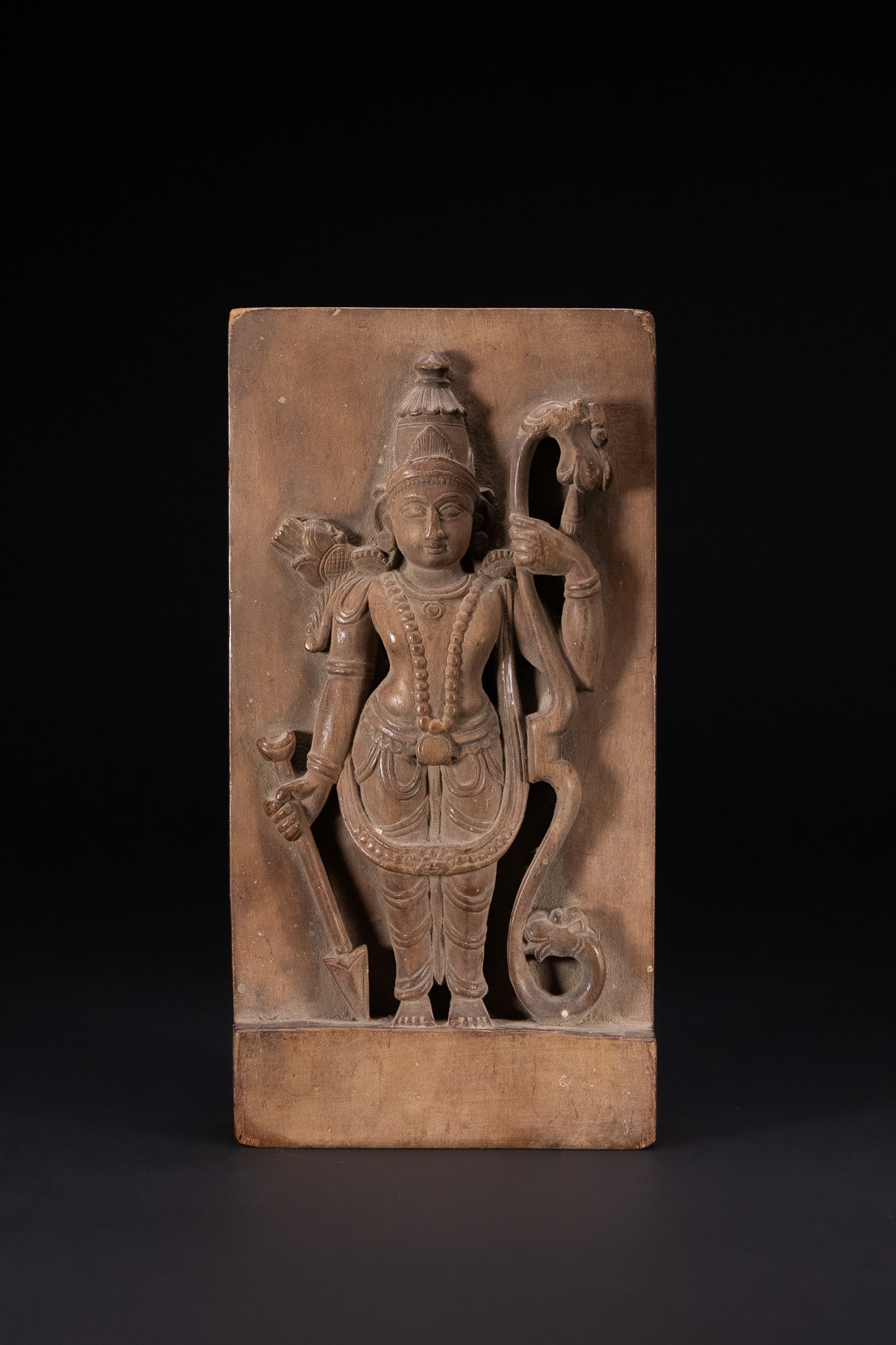 A SOUTHERN INDIAN CARVED HARDWOOD RELIEF PLAQUE OF LORD RAMA, LATE 19TH OR EARLY 20TH CENTURY. (1 of 3)