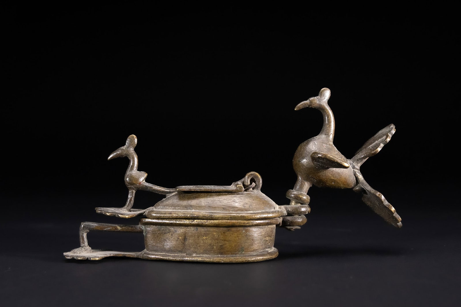 AN INDIAN BRONZE PEACOCK KOHL OR KUMKUM CONTAINER ANJANDANI, DECCAN REGION, LATE 19TH CENTURY / (1 of 4)