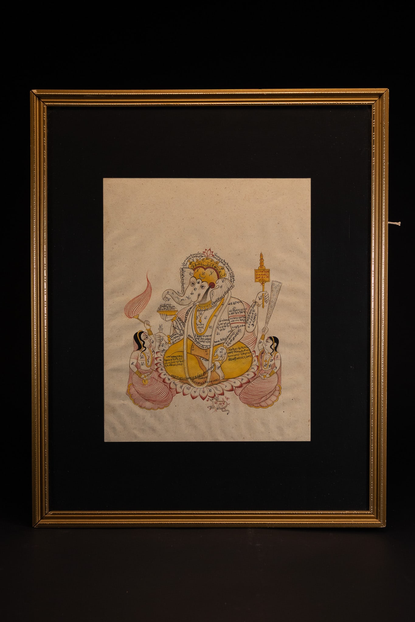 INDIAN SCHOOL, 20TH CENTURY, A CALLIGRAPHIC MINIATURE PAINTING OF LORD GANESHA. (1 of 1)