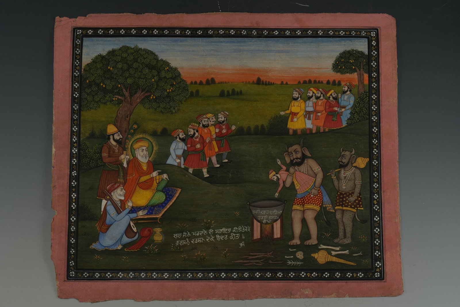 AN INDIAN SIKH PAINTING DEPICTING GURU NANAK AND THE REDEMPTION OF KAUDA RAKSHASH, 19TH CENTURY. (1 of 5)