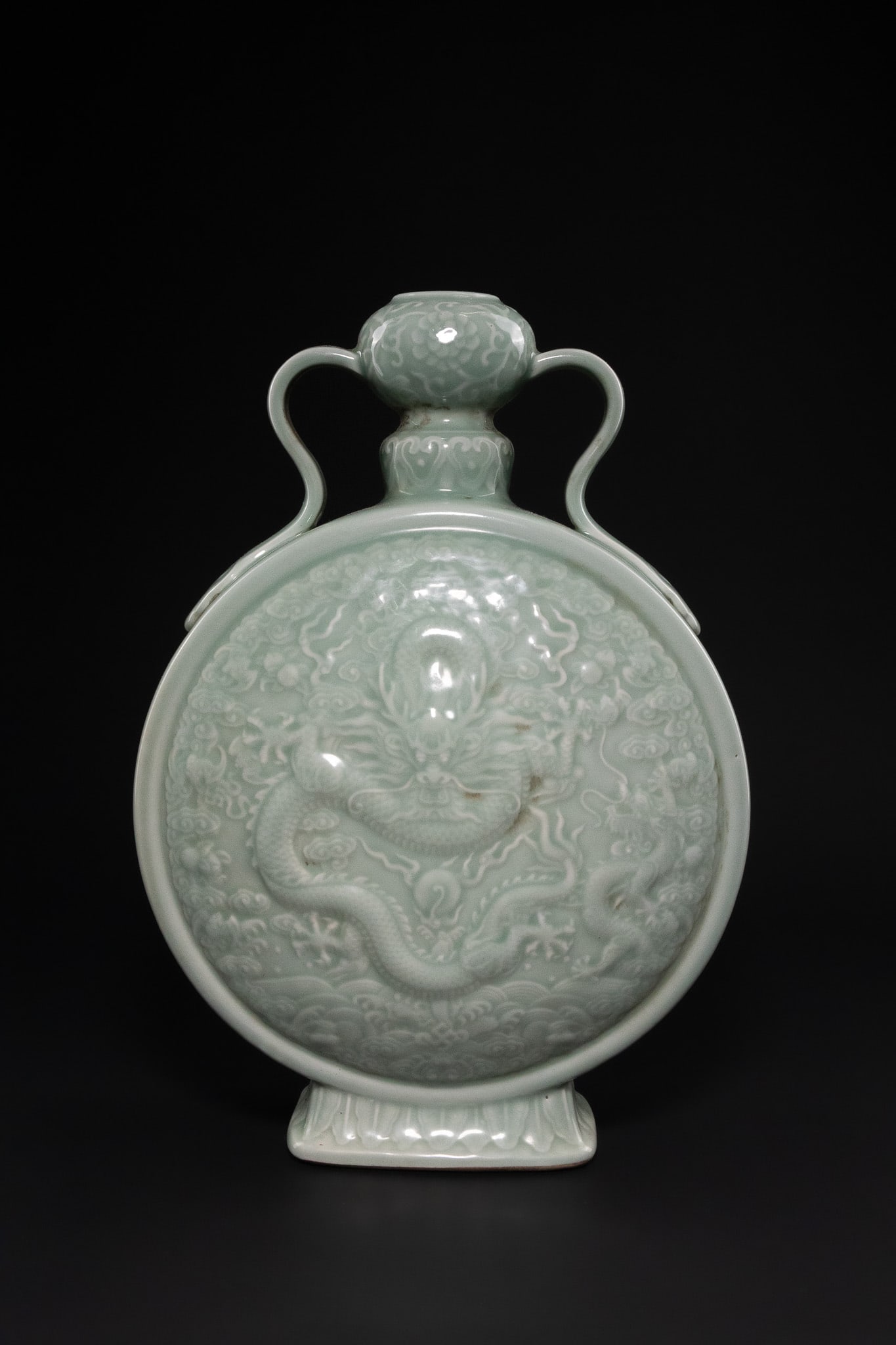 A CHINESE CELADON-GLAZED CARVED DRAGON MOONFLASK, QIANLONG MARK. (1 of 7)