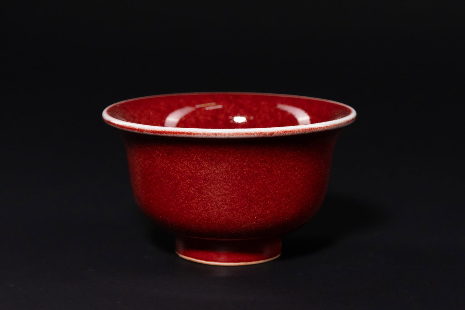 A CHINESE COPPER-RED GLAZED PORCELAIN BOWL, QING DYNASTY OR LATER (1 of 3)