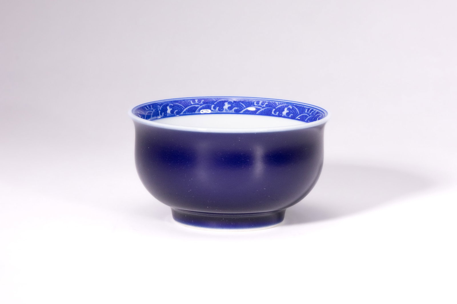A CHINESE BLUE GLAZED AND UNDERGLAZE BLUE DRAGON BOWL, YONGZHENG MARK. (1 of 3)