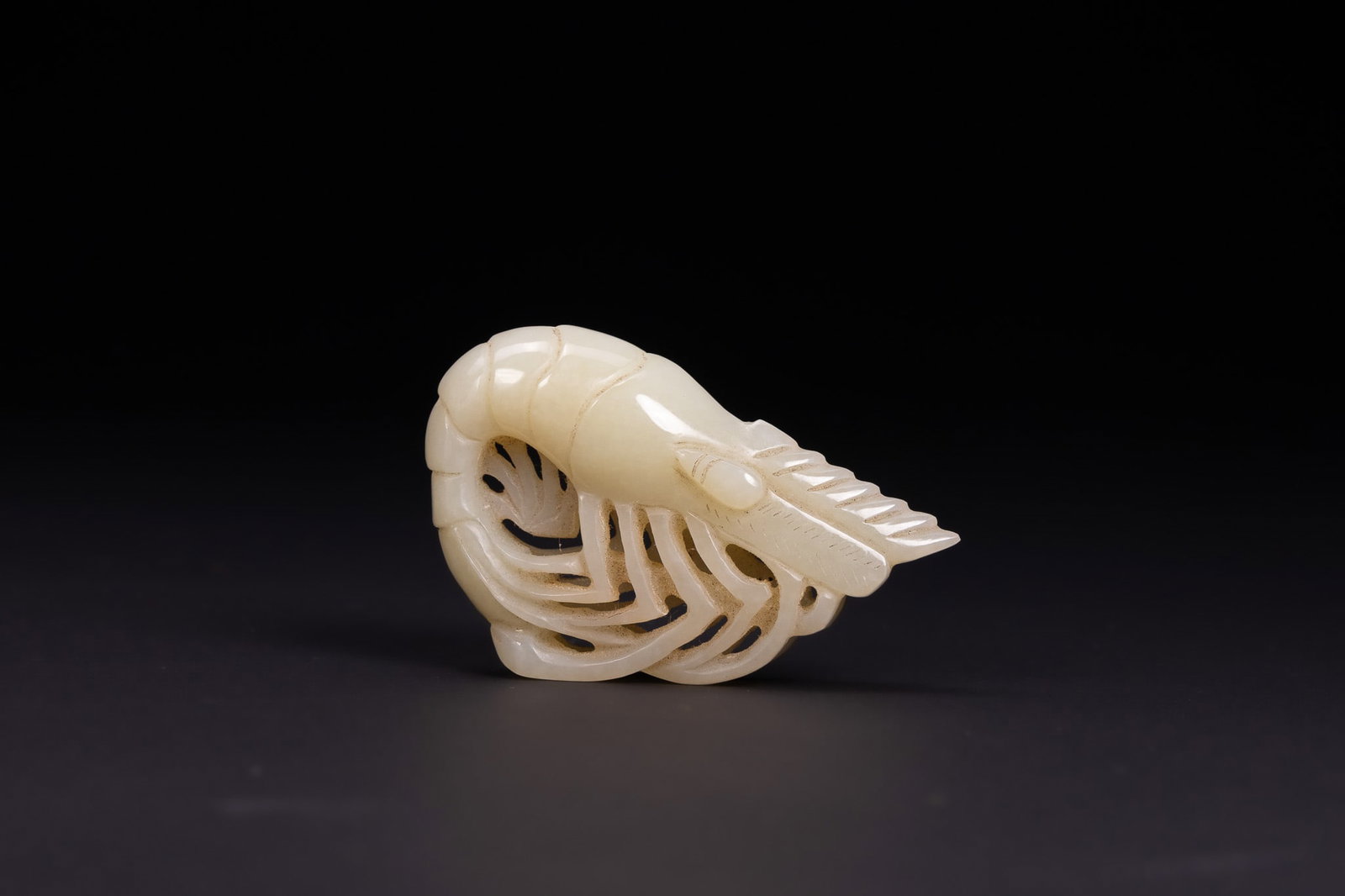 A CHINESE PALE CELADON JADE CARVING OF A SHRIMP, LATE QING DYNASTY OR REPUBLIC PERIOD. (1 of 2)