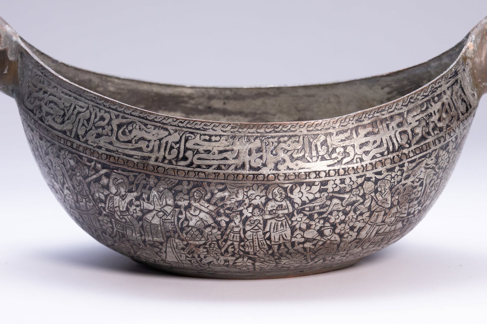 AN INDO-PERSIAN TINNED-COPPER KASHKUL (BEGGING BOWL). - 2