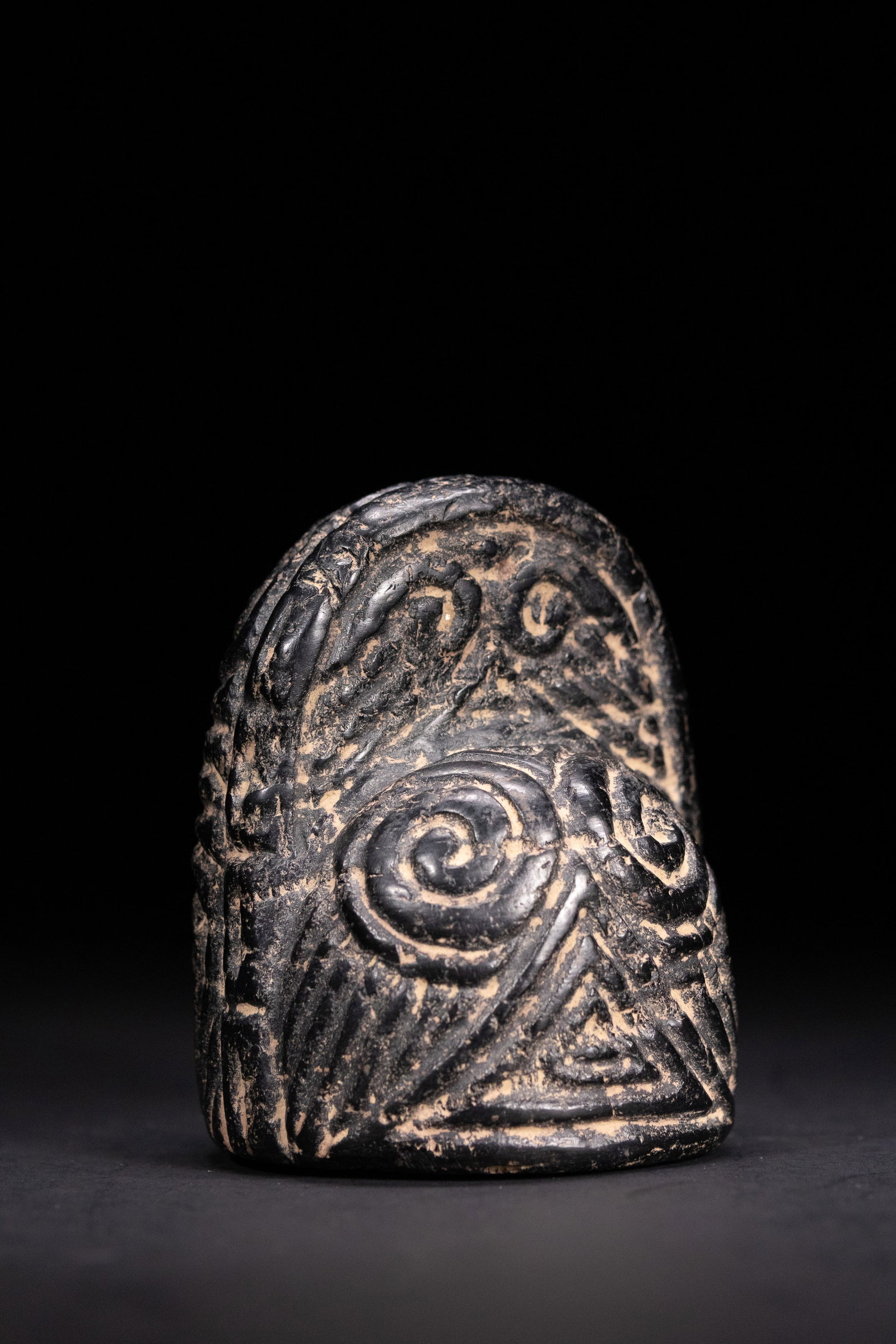 A FATIMID JET KING OR QUEEN CHESS PIECE, 11THâ€“13TH CENTURY. (1 of 3)