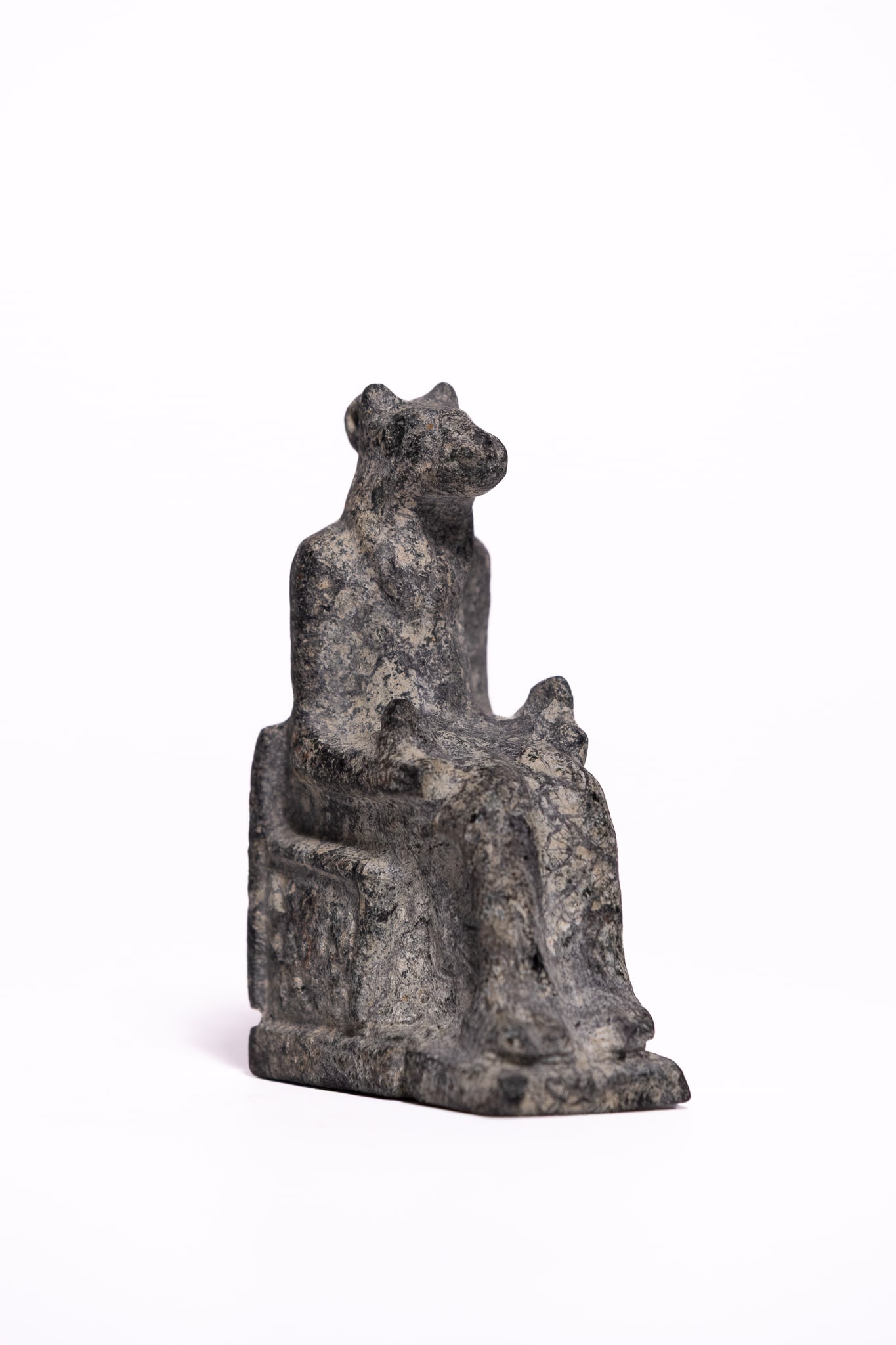 AN EGYPTIAN CARVED STONE AMULET OF A SEATED LIONESS-HEADED GODDESS, LATE PERIOD TO PTOLEMAIC PERIOD, (1 of 3)