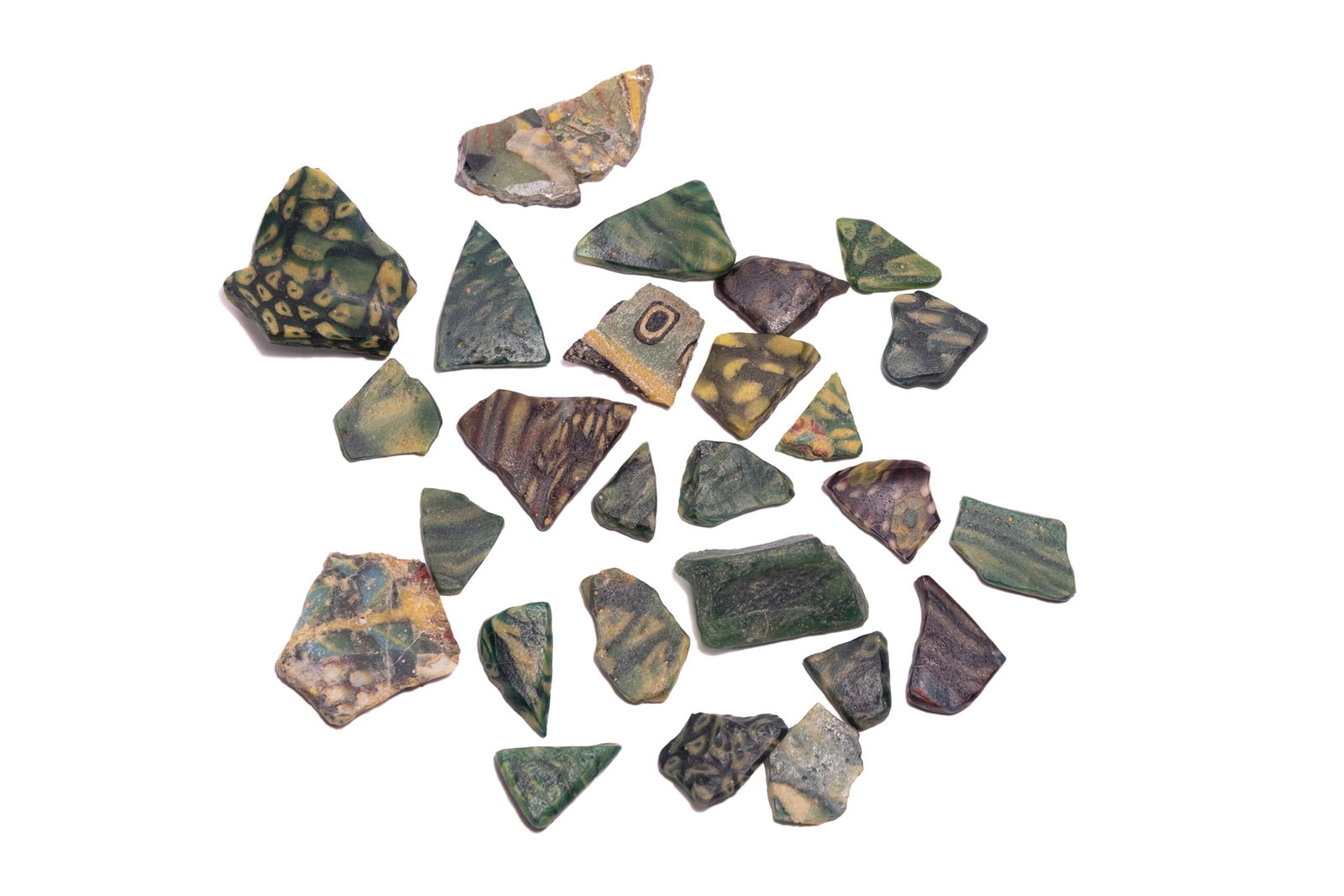 A GROUP OF ANCIENT EGYPTIAN AND ROMAN MOSAIC AND RIBBON GLASS FRAGMENTS (1 of 3)