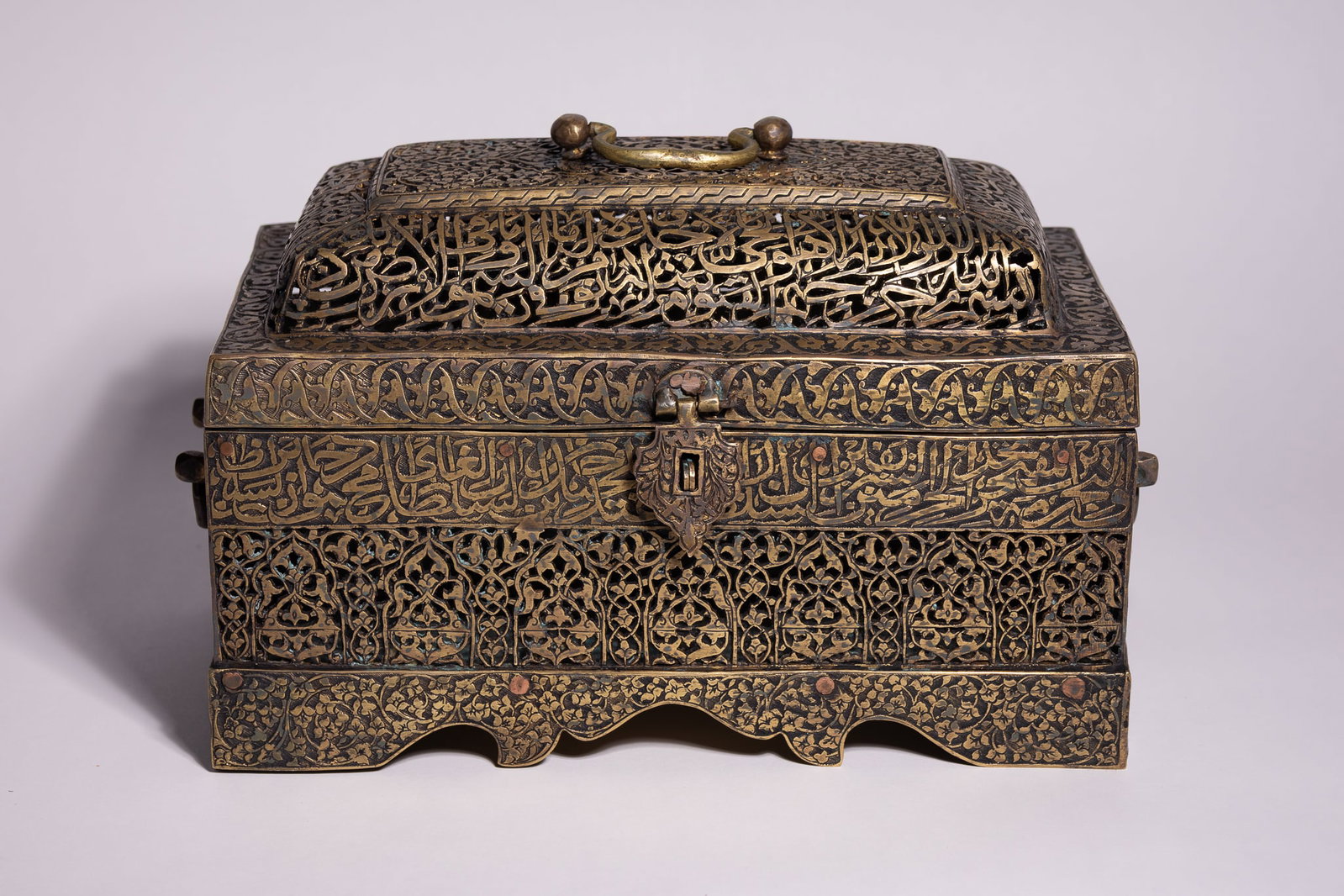 A QAJAR PIERCED AND ENGRAVED BRASS QUR'AN BOX, PERSIA, 19TH CENTURY. (1 of 5)