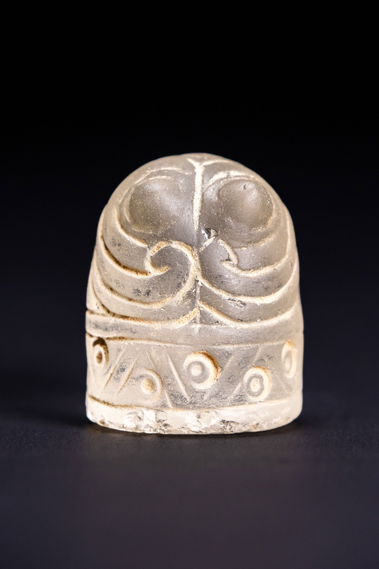 A FATIMID STYLE CARVED ROCK CRYSTAL CHESS PIECE.: An early Islamic style carved rock crystal gaming piece, identified as a pawn or baidaq. The object is fashioned from natural clear rock crystal and features a cylindrical form with a rounded dome and