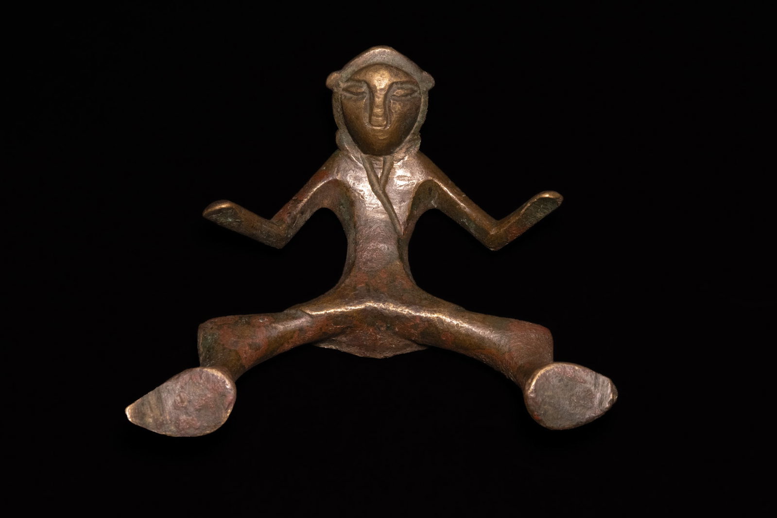 A SELJUK SILVER-INLAID BRONZE FIGURAL HANDLE, 12TH CENTURY. (1 of 3)