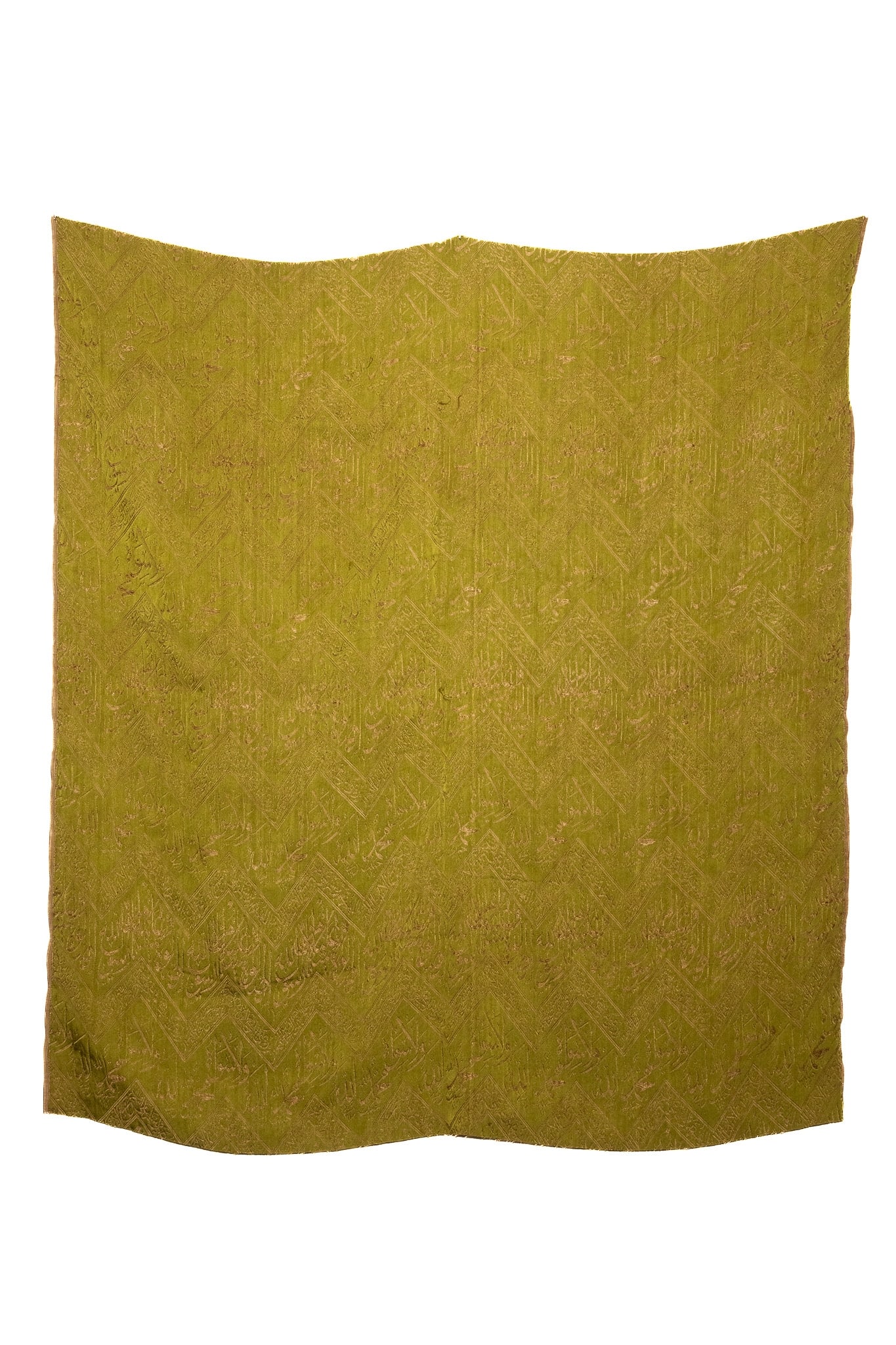 AN OTTOMAN FABRIC BROCADE FRAGMENT WITH WOVEN ARABIC CALLIGRAPHY, 20TH CENTURY. (1 of 2)