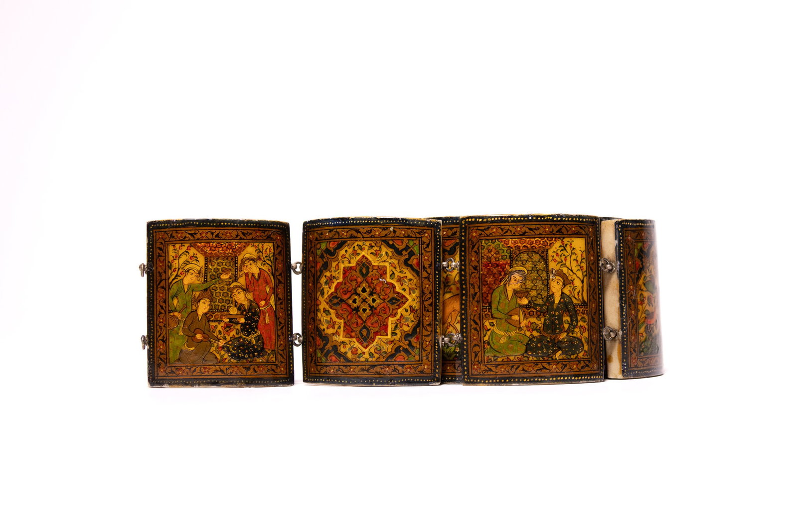 A PERSIAN HAND-PAINTED BONE LINK BELT, ISFAHAN, DATED 1917.: A multi-panel link belt comprising rectangular, slightly curved panels of polished bone, joined by white metal wire loops and jump rings. Each panel is hand-painted in the Persian miniature style with