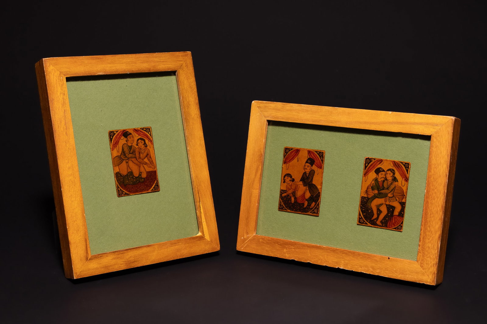 A TRIO OF QAJAR EROTIC MINIATURE PAINTINGS, 19TH CENTURY.: The works are rendered in gouache with gold leaf highlights on panels. Each miniature depicts a couple in an intimate scene, with the male figures wearing traditional Qajar-period attire, including ch