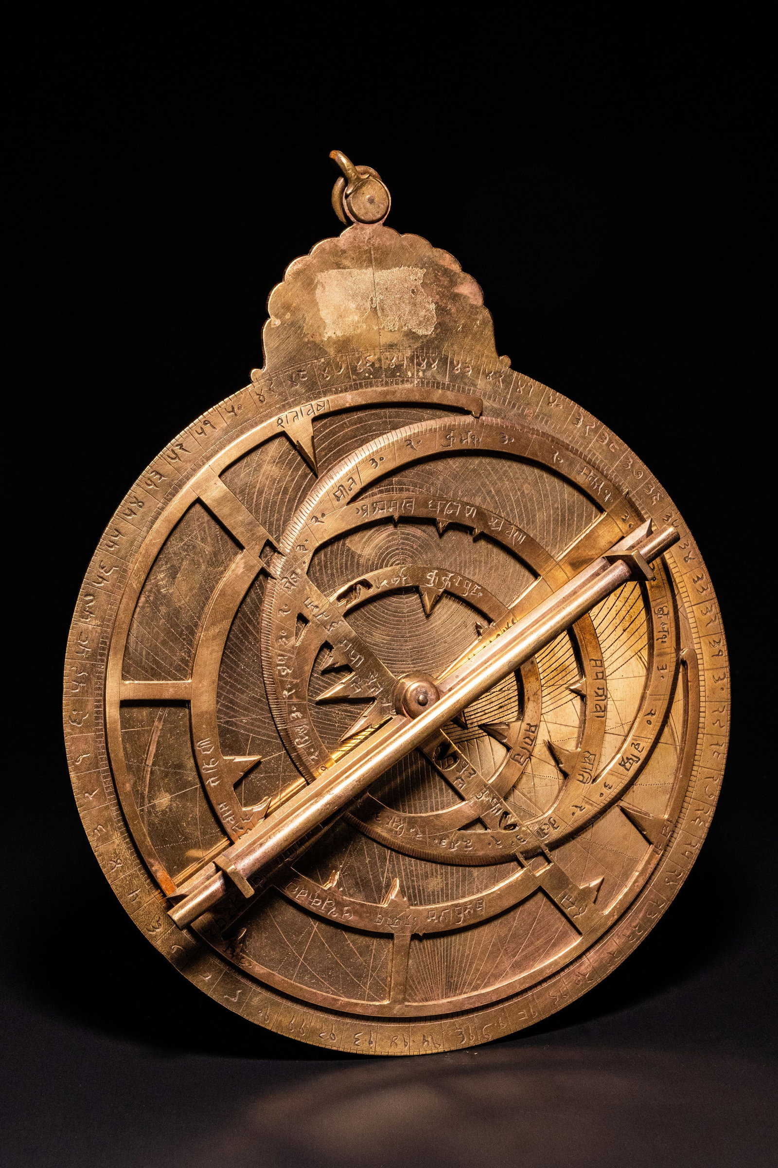 AN INDO-PERSIAN BRONZE PLANISPHERIC ASTROLABE WITH DEVANAGARI SCRIPT. (1 of 5)