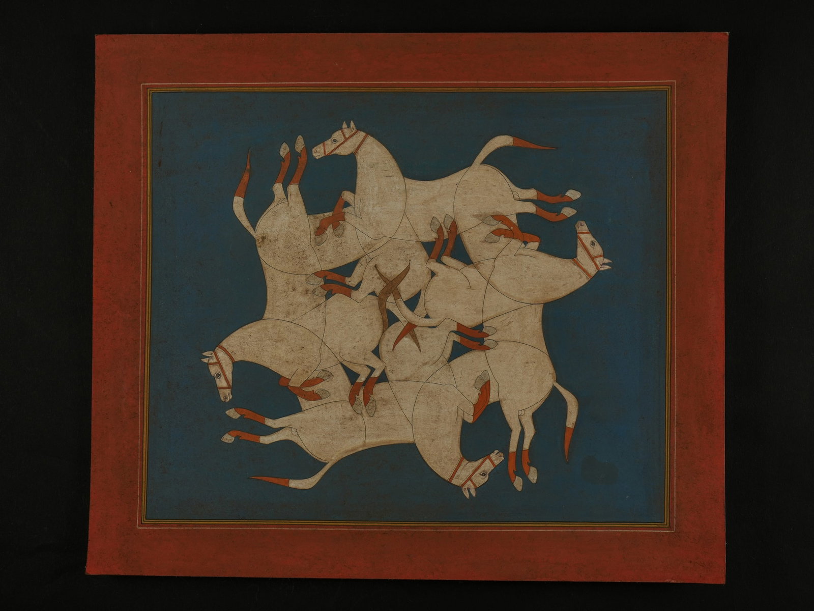 AN INDIAN MINIATURE PAINTING OF INTERLOCKING WHITE HORSES, 19TH CENTURY.: The painting presents a dynamic composition of multiple white horses arranged in a circular, interlocking formation, their bodies overlapping and rotating around a central point. Each horse is rendere