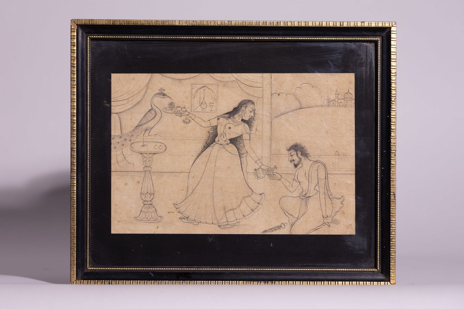 AN INDIAN PEN AND INK NIM QALAM DRAWING OF A COURTLY SCENE, LATE 19TH OR EARLY 20TH CENTURY.: An Indian pen and ink line drawing on paper, executed in the Nim Qalam technique. The composition features a central female figure in traditional dress and jewellery, shown standing beside an ornate p