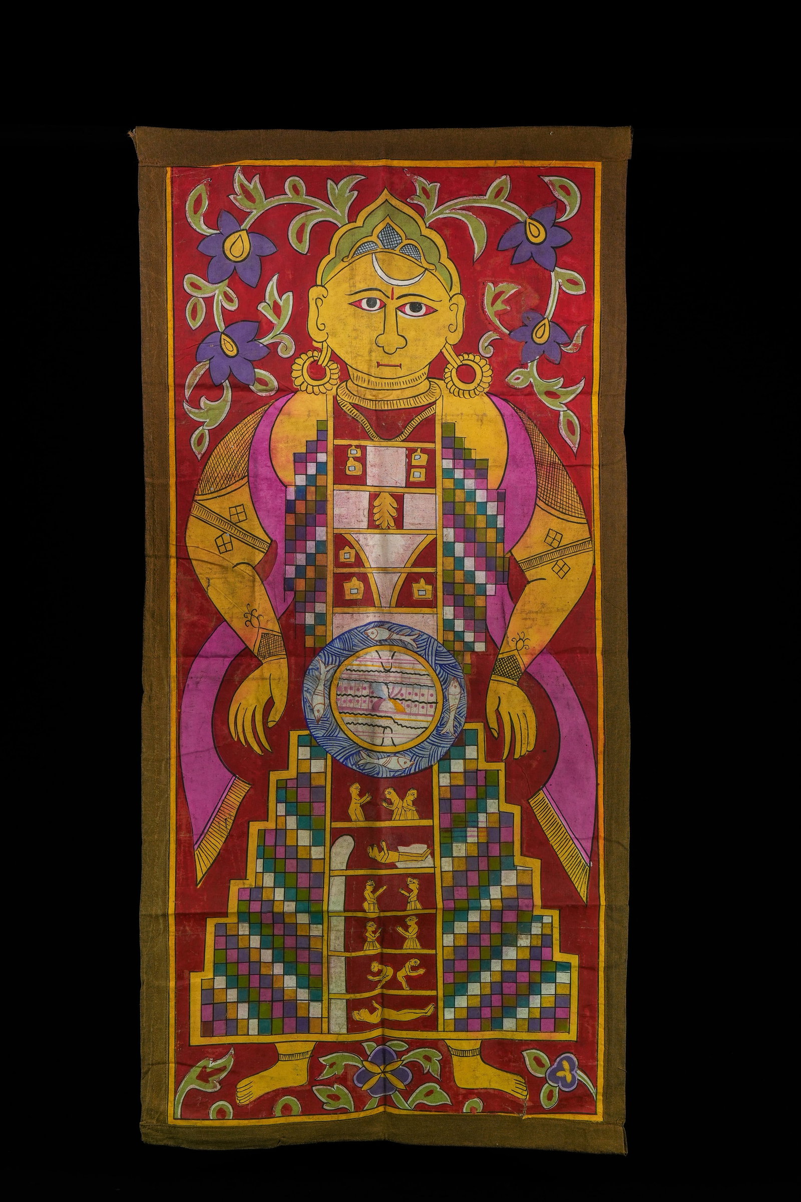 AN INDIAN JAIN TANTRIC PAINTING OF A STANDING DEITY FIGURE, 18TH CENTURY OR LATER.: A vibrant Indian Jain tantric painting depicting a frontally posed deity figure framed within a tall rectangular format. The figure is shown with a prominent yellow face, large almond-shaped eyes, red