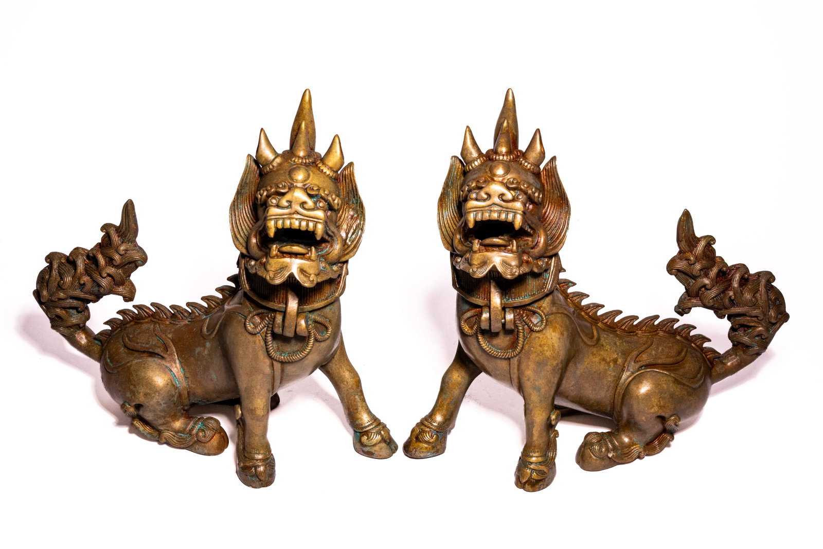 A PAIR OF TIBETAN BRONZE CHINTHE GUARDIAN LION FIGURES, 19TH CENTURY. (1 of 6)