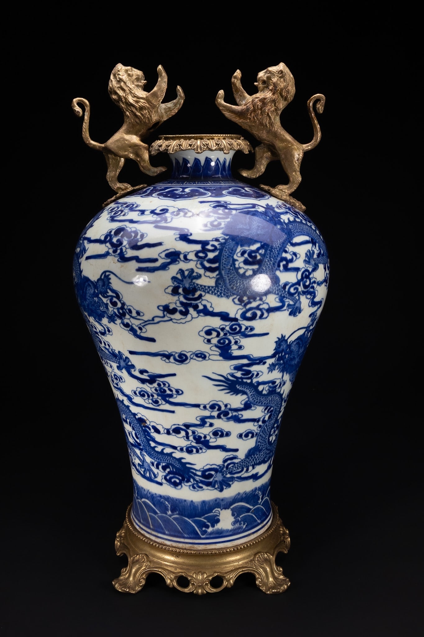 A CHINESE BLUE AND WHITE PORCELAIN 'DRAGON' VASE WITH GILT-METAL MOUNTS. (1 of 6)