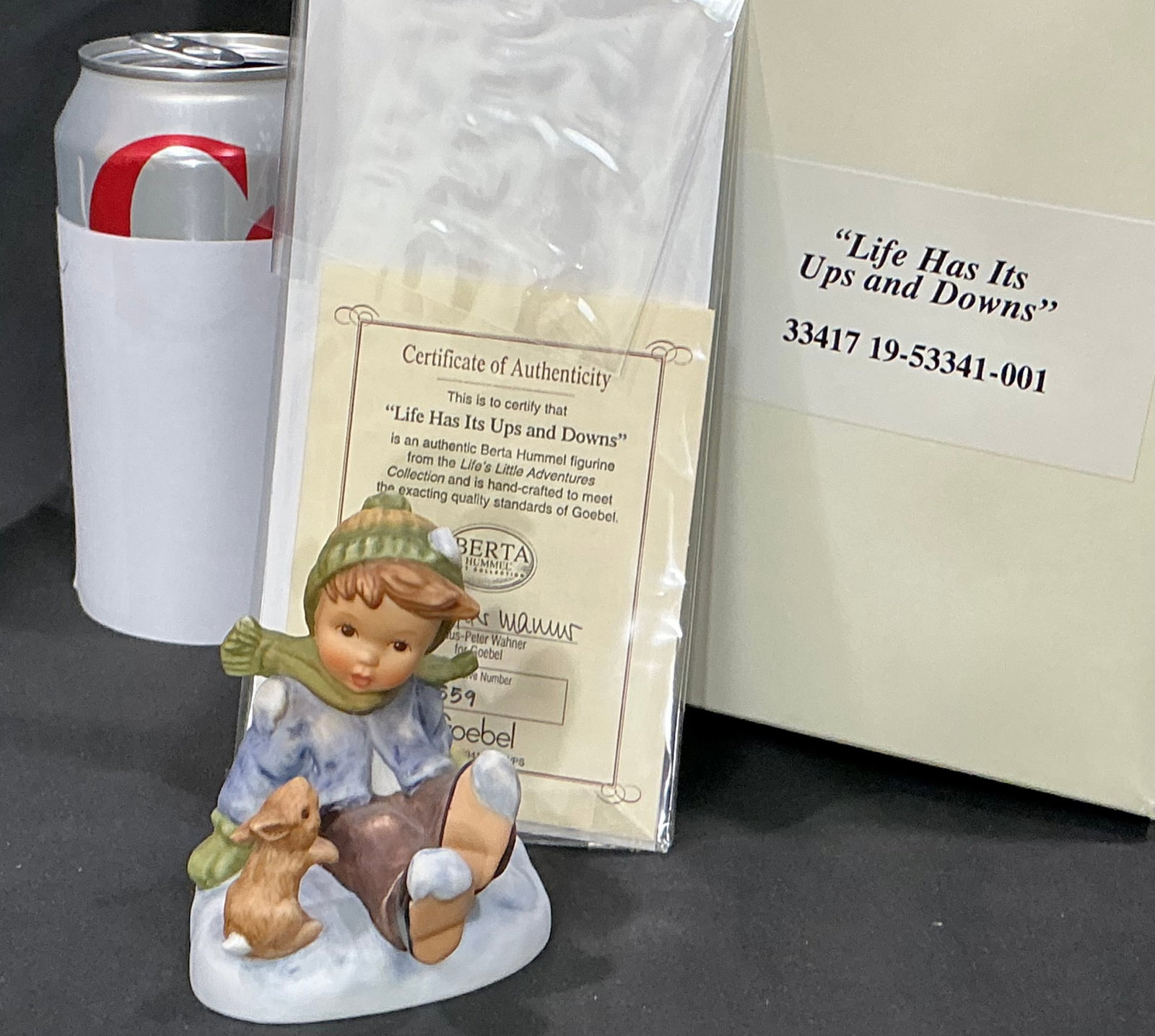 Berta Hummel Figurine "Life Has Its Ups and Downs" by Goebel with Box and COA: Young boy seated in snow with a rabbit; includes Goebel box and COA A3549.