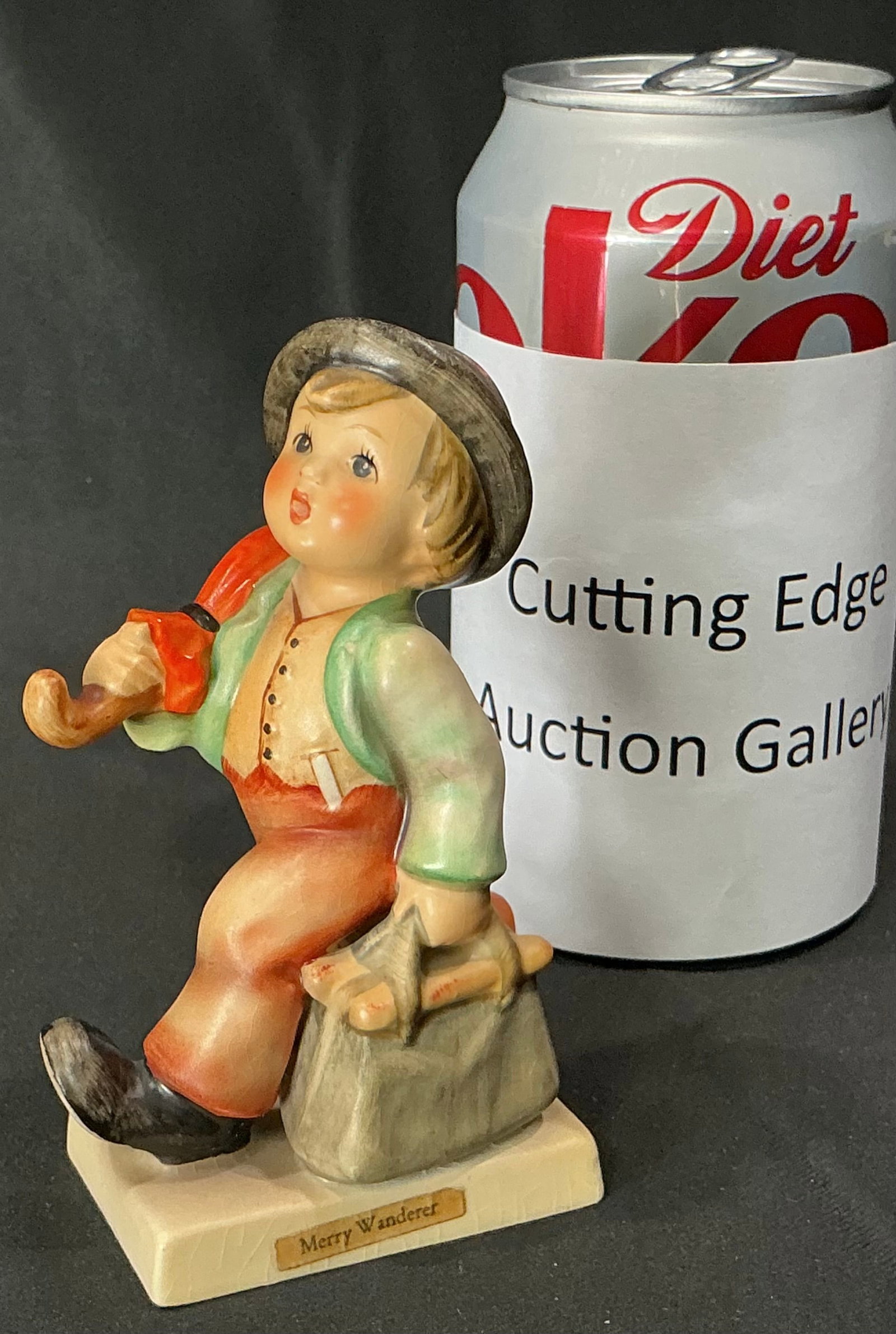 Vintage Goebel Hummel "Merry Wanderer" Figurine Hum 11, W. Germany: Classic Goebel Hummel figurine titled "Merry Wanderer", model Hum 11. Depicts a jaunty young traveler with an umbrella and satchel, taking a confident stride forward with a cheerful expression. One of