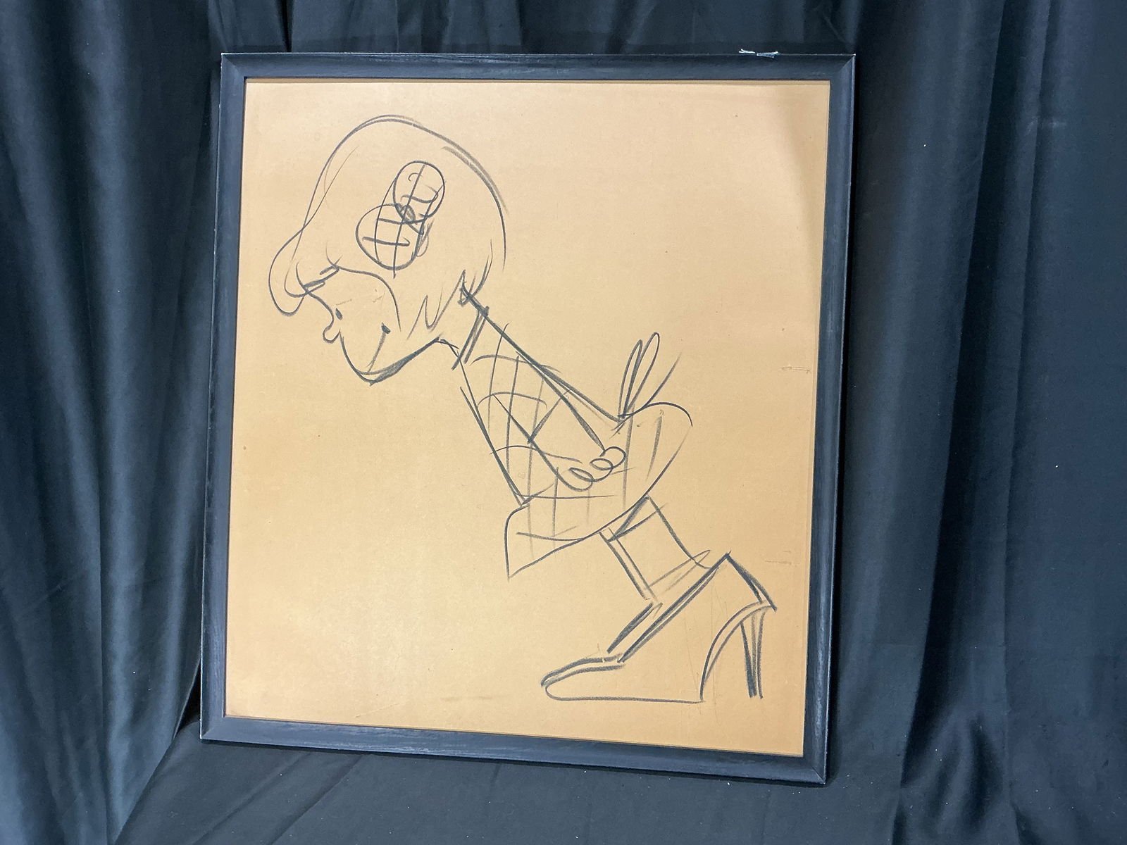 Large Framed Charcoal Drawing of Lucy Van Pelt believed to be by Charles M. Schulz: Large framed charcoal drawing depicting Lucy Van Pelt in a stylized profile composition. Executed in charcoal on paper and presented in a black frame. No signatures or COA.