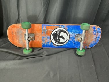 Vintage Dealer-branded complete skateboard with green wheels