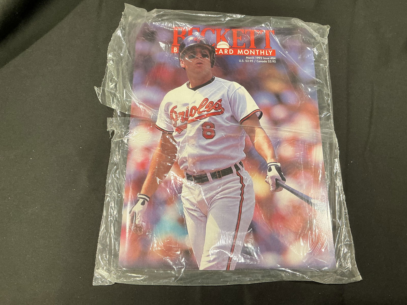 Beckett Baseball Card Monthly (March 1992, Issue #84) – Cal Ripken Jr Cover (Sealed): Sealed vintage issue of Beckett Baseball Card Monthly, March 1992 (Issue #84), featuring Baltimore Orioles star Cal Ripken Jr on the cover. Includes the original Beckett Bonus subscription/renewal mai