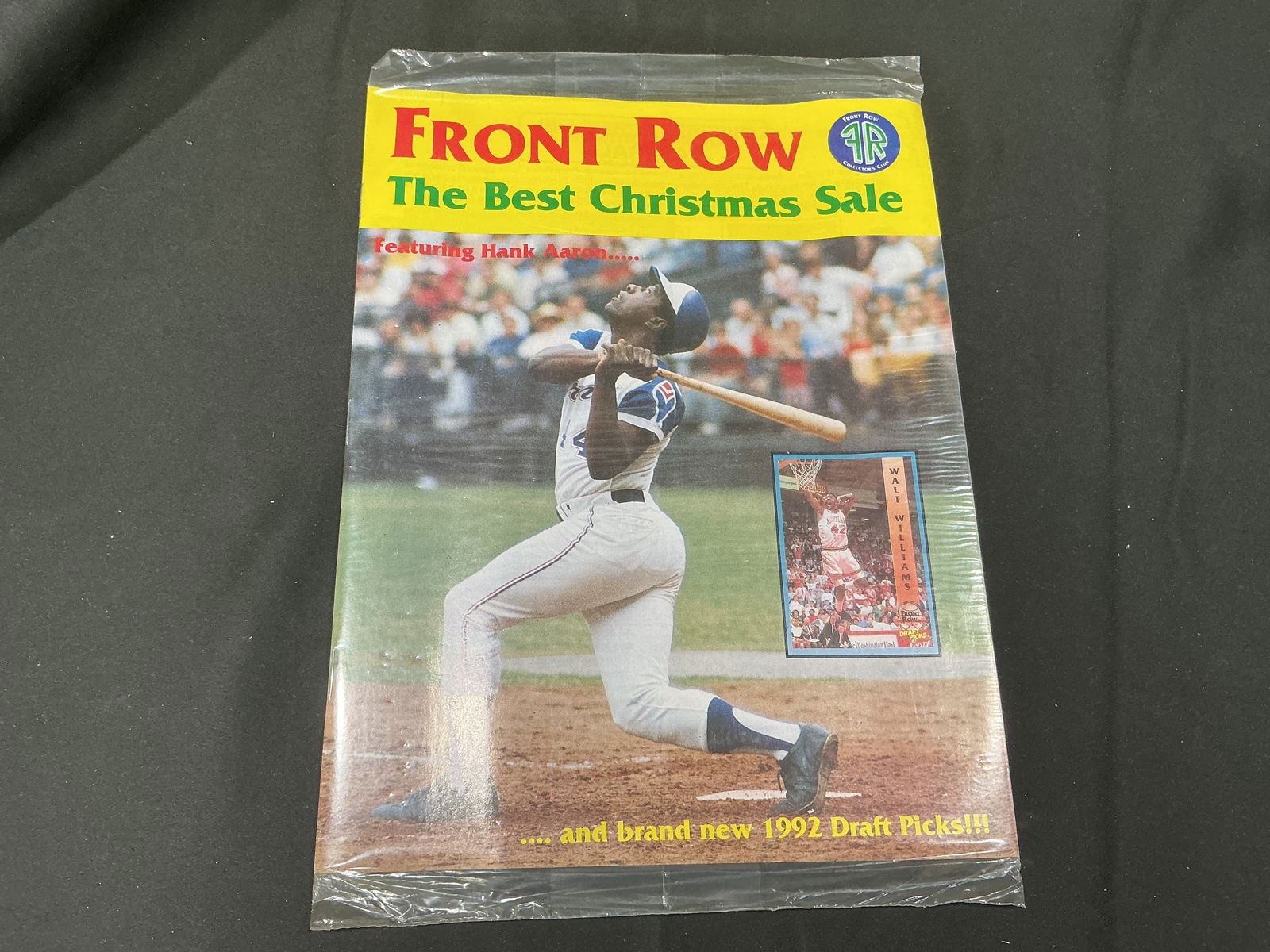 Front Row Sports Cards Magazine – Hank Aaron Cover with Hologram Offer Insert: Sealed vintage Front Row sports card magazine featuring Hank Aaron on the cover. Includes hologram offers and promotional insert from BTS Sports Cards. Original mailing sleeve included. Please review