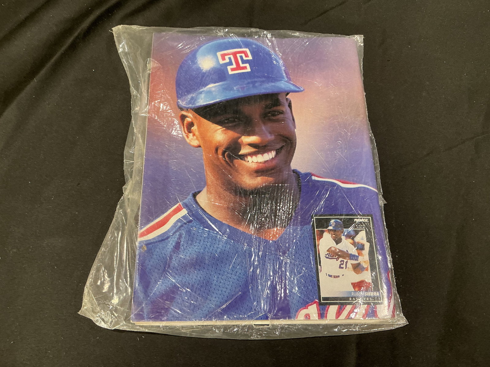 Ruben Sierra Display Photo with Beckett Storage Insert: Oversized display photo of MLB star Ruben Sierra with inset trading card. Includes Beckett Baseball Card Monthly storage advertisement insert.