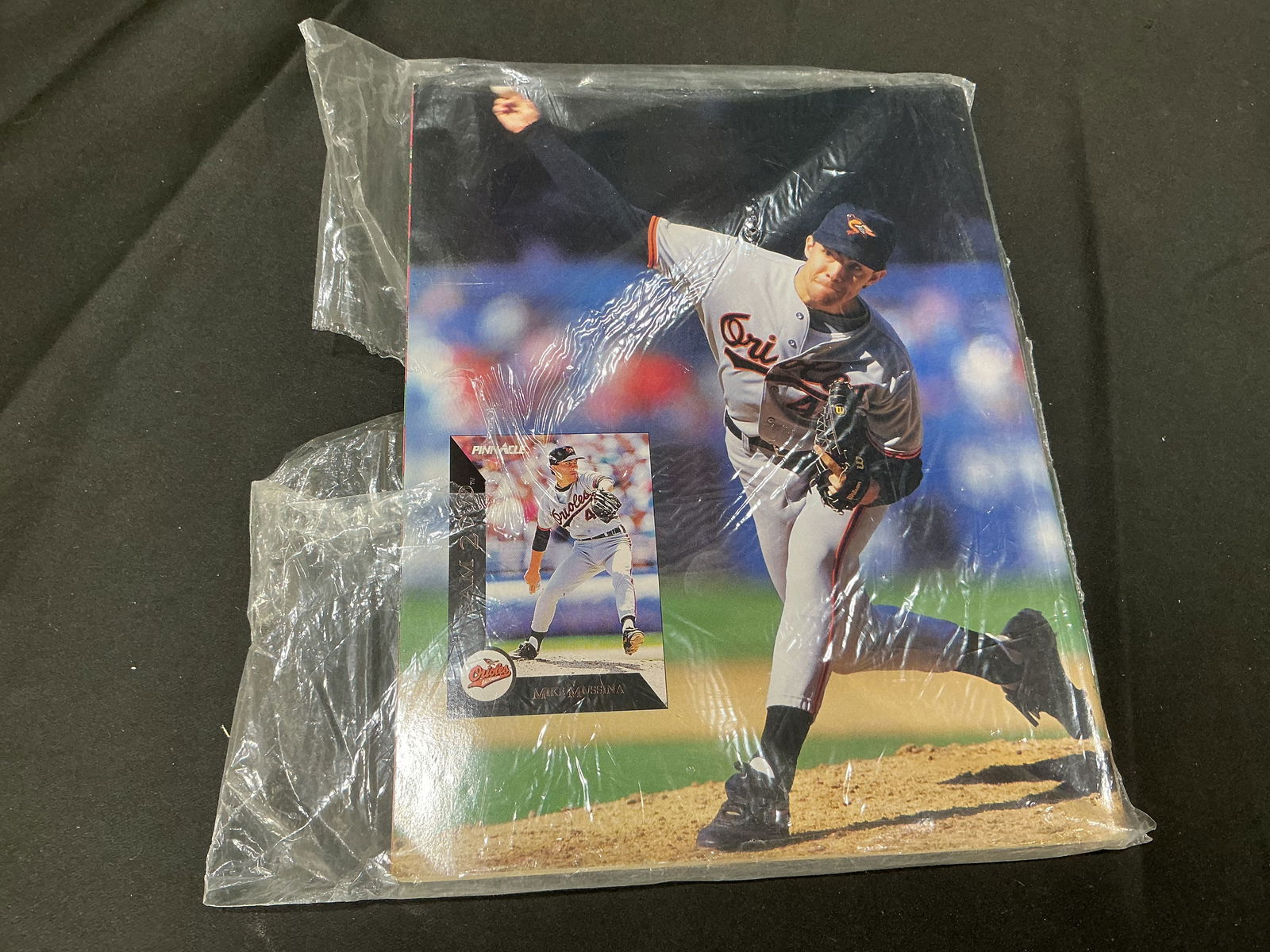 Vintage Baltimore Orioles Pitcher Mike Mussina Photo Display with Trading Card: Original vintage sports photo display featuring MLB pitcher Mike Mussina of the Baltimore Orioles, paired with an inset trading card. Includes original mailing backer with holiday-themed Beckett Baseb