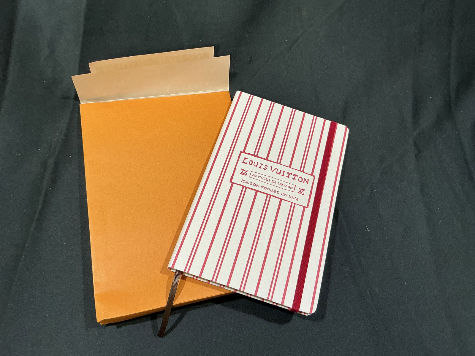 Louis Vuitton Articles de Voyage Striped Canvas Notebook with Original Box: Chic Louis Vuitton Articles de Voyage notebook featuring a red and white striped textile cover with the Maison's heritage logo reading Louis Vuitton, Articles de Voyage, Maison Fondee en 1854.