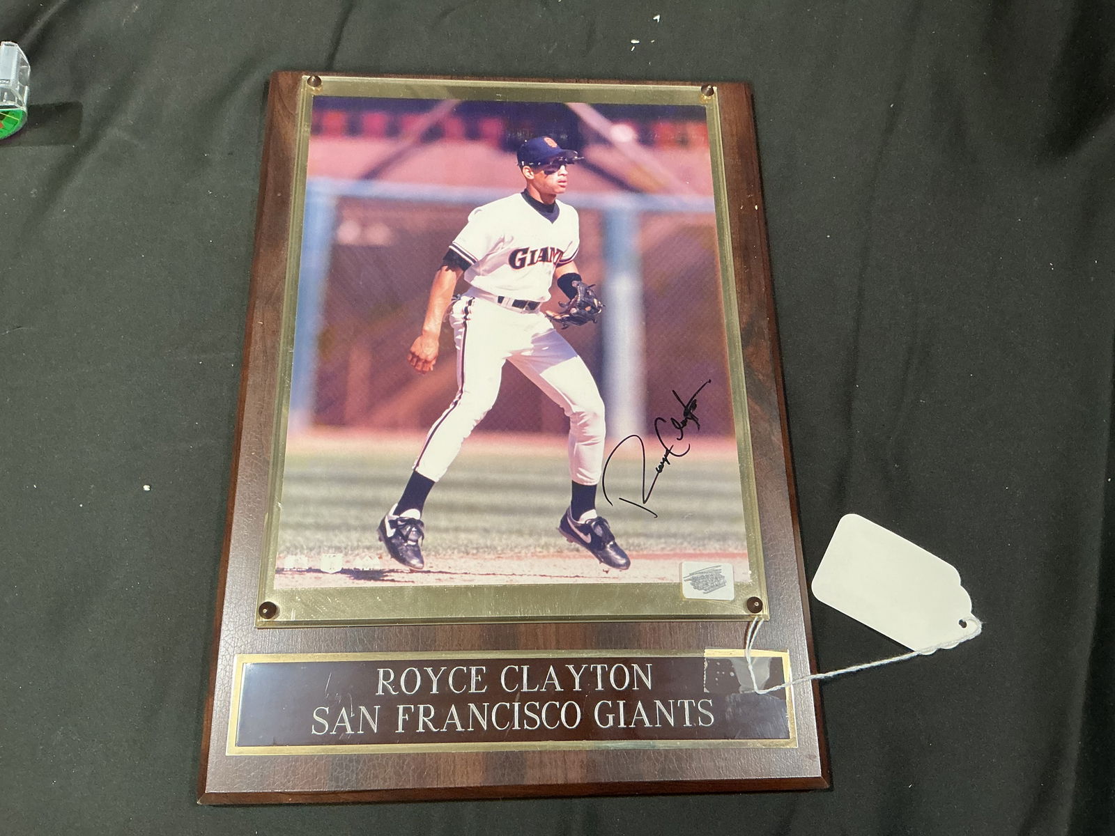 Royce Clayton Signed San Francisco Giants Plaque: Autographed Royce Clayton San Francisco Giants display plaque featuring a bold signature on a mounted action photo.