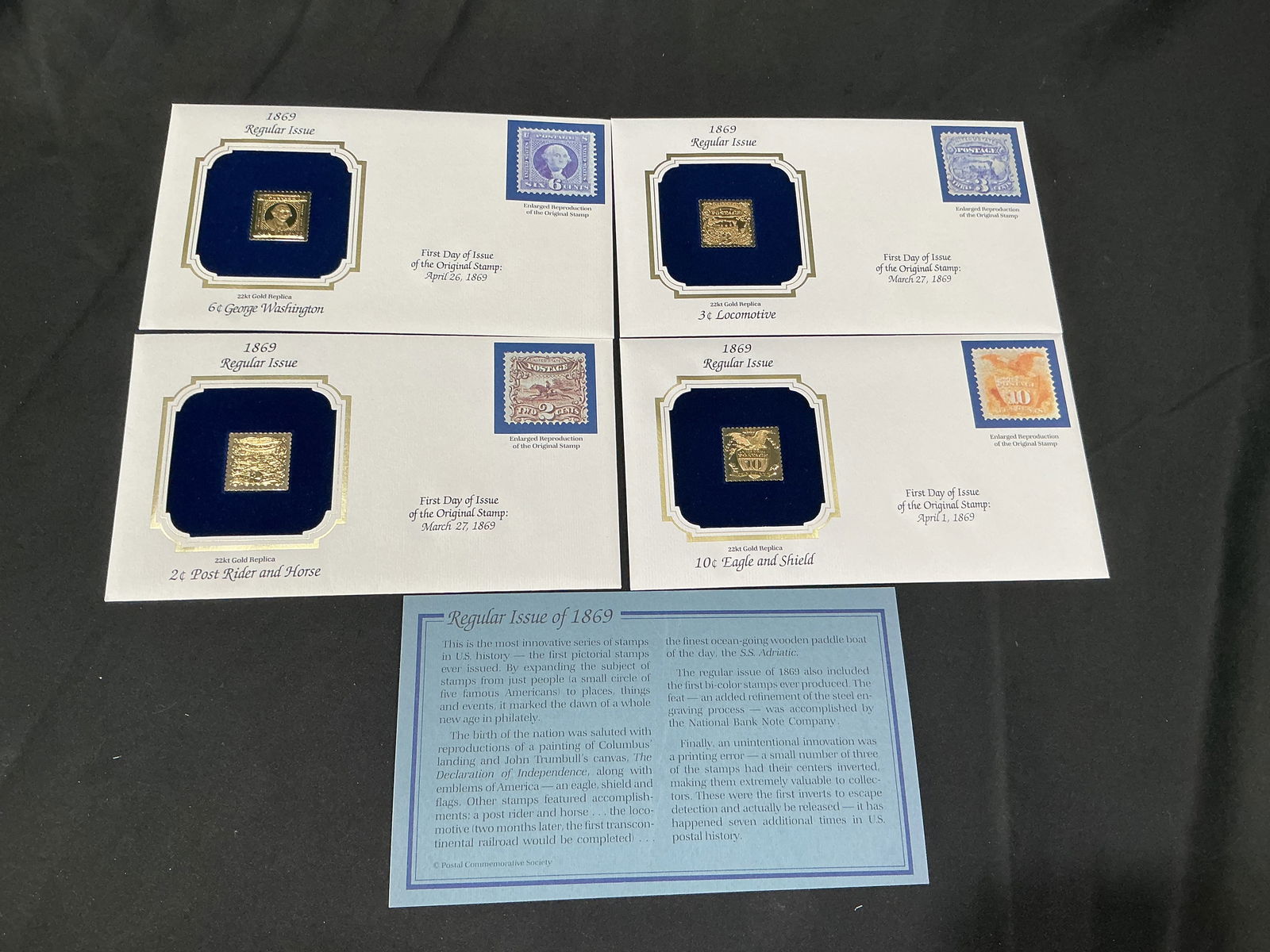 1869 Pictorial Issue 22kt Gold Replica Quartet Washington Locomotive Eagle: Four 22kt gold replicas from the celebrated 1869 pictorial series, including 6c Washington, 3c Locomotive, 2c Post Rider and Horse and 10c Eagle and Shield. Presented in original blue velvet cards wit