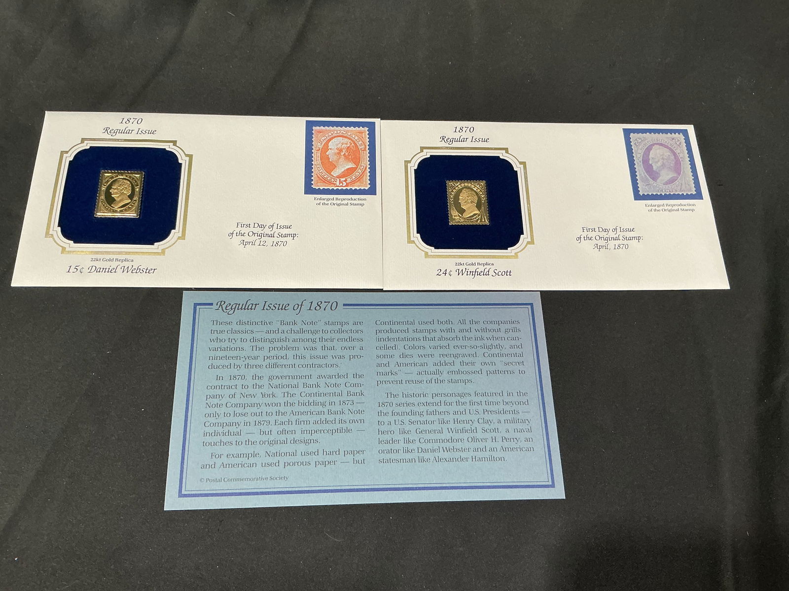 1870 Bank Note Issue 22kt Gold Replica Pair Webster Scott and Daniel Webster: Matched pair of 22kt gold replicas from the 1870 Bank Note series, comprising the 15c Daniel Webster and 24c Winfield Scott. Housed in their original blue velvet presentation cards and accompanied by