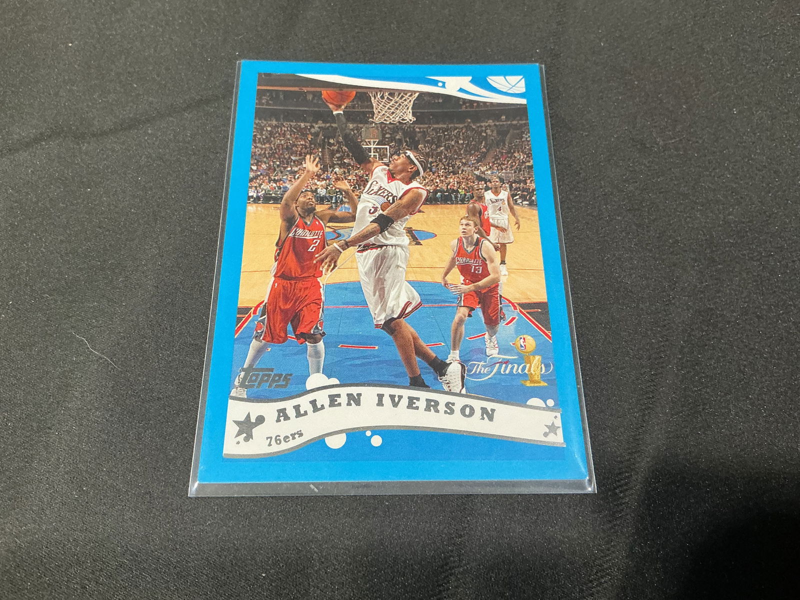 2006 Topps Allen Iverson Philadelphia 76ers Basketball Card NBAF-1: 2006 Topps basketball card featuring NBA superstar Allen Iverson of the Philadelphia 76ers. Action image of Iverson driving to the basket with career statistics and player biography on the reverse. Ca