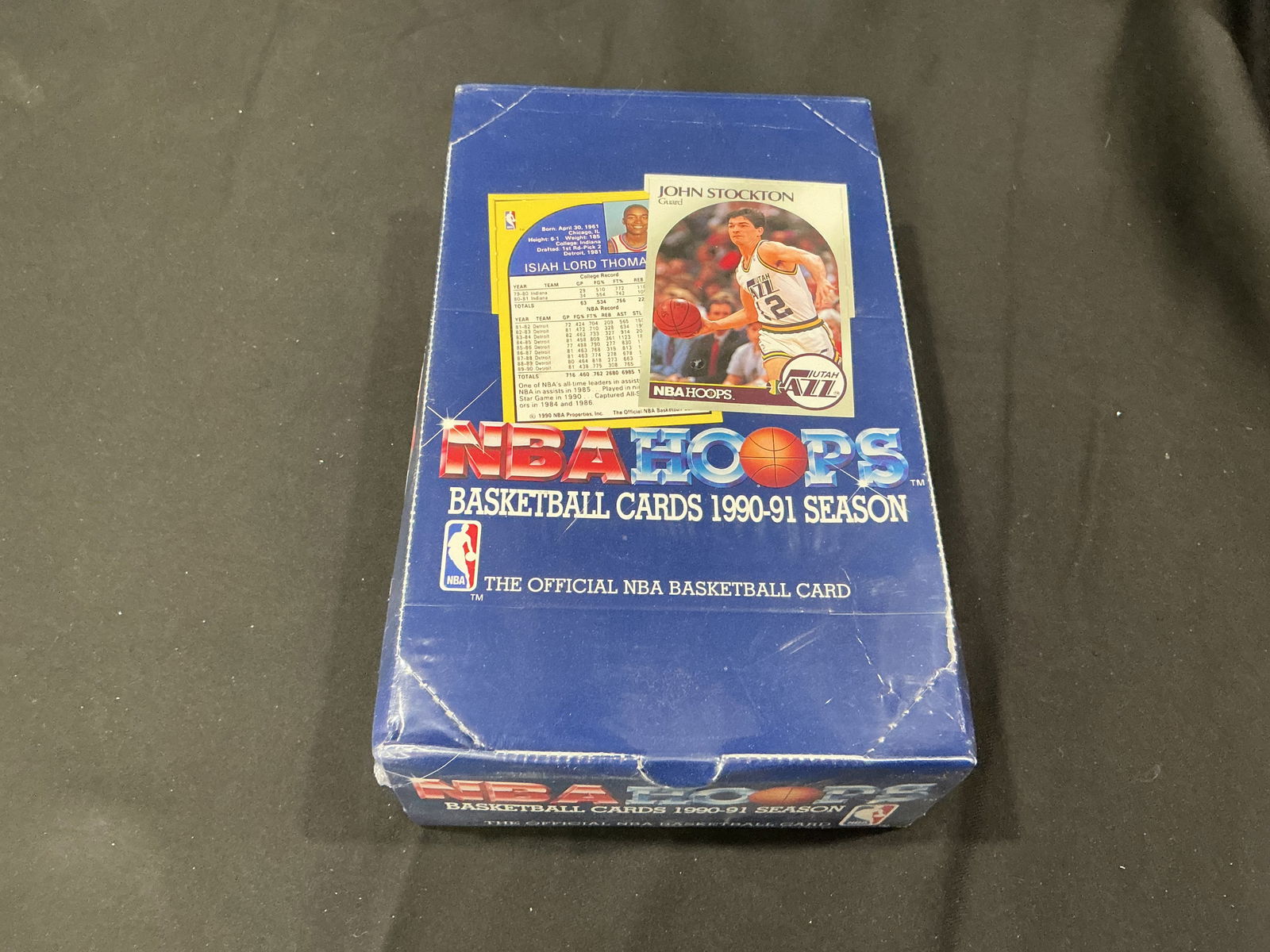 1990-91 NBA Hoops Basketball Cards Wax Pack Box: 1990-91 NBA Hoops basketball trading card wax pack box featuring classic early 1990s NBA stars including Michael Jordan, Magic Johnson, Larry Bird, John Stockton, and others. Box appears opened with