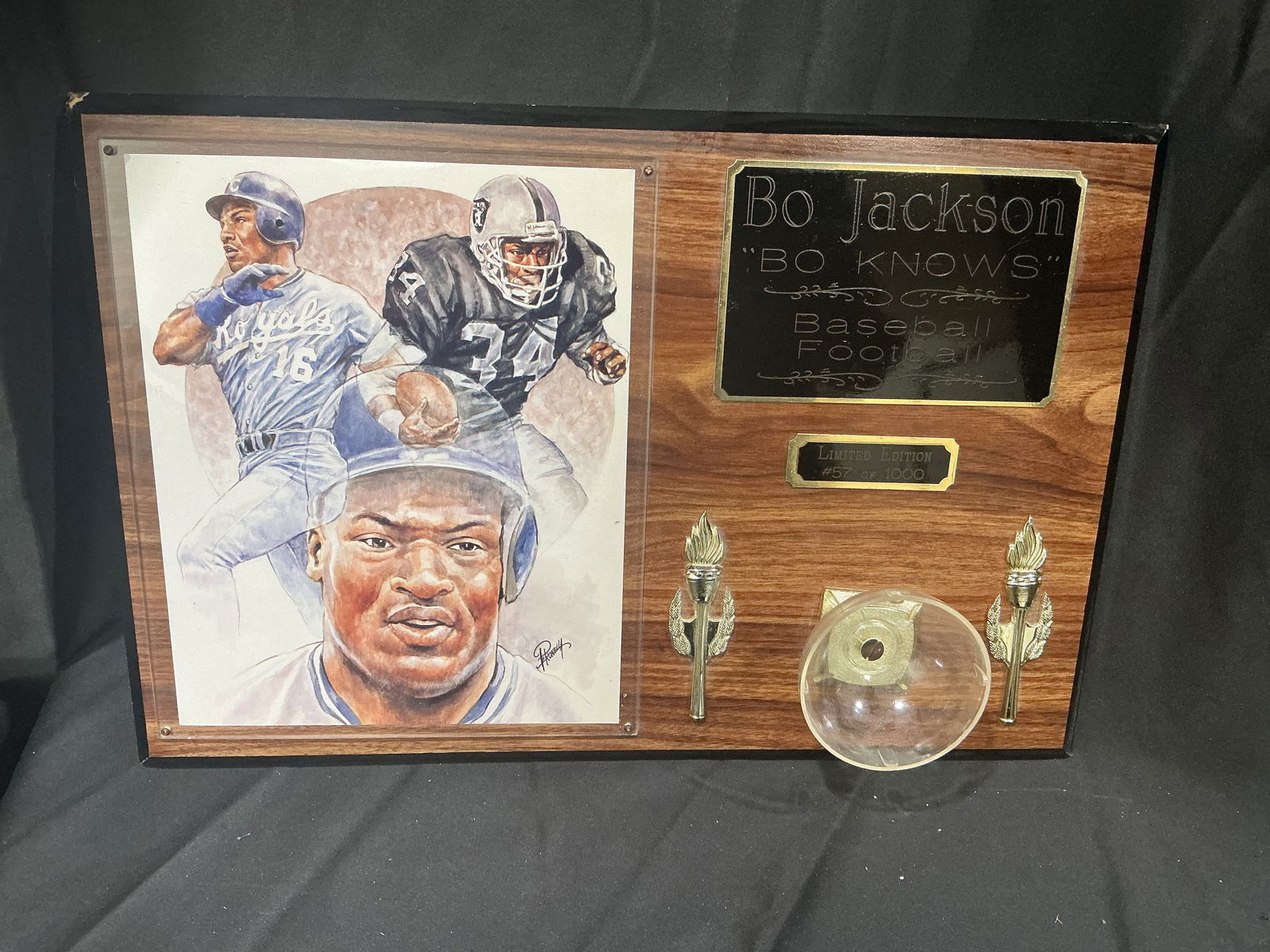 Bo Jackson “Bo Knows” Limited Edition Wall Plaque #57/1000 – My Favorite Players: Officially licensed “Bo Knows Baseball Football” dual-sport commemorative wall plaque featuring artwork of Bo Jackson in Kansas City Royals and Los Angeles Raiders uniforms. Mounted on wood