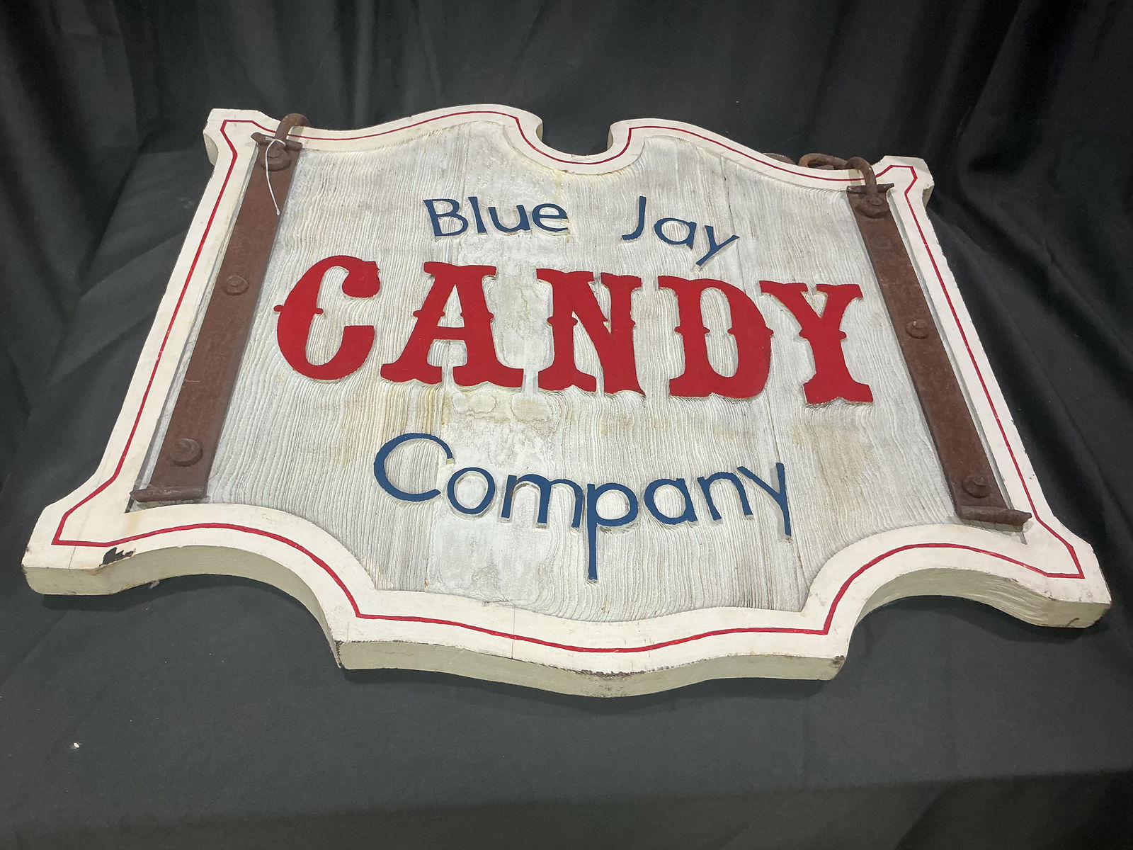 Vintage Blue Jay Candy Company Carved Wooden Trade Sign: Large double-sided carved wooden hanging trade sign for the Blue Jay Candy Company. Bold raised red lettering for CANDY flanked by blue Blue Jay and Company set on a white ground with red pinstriping