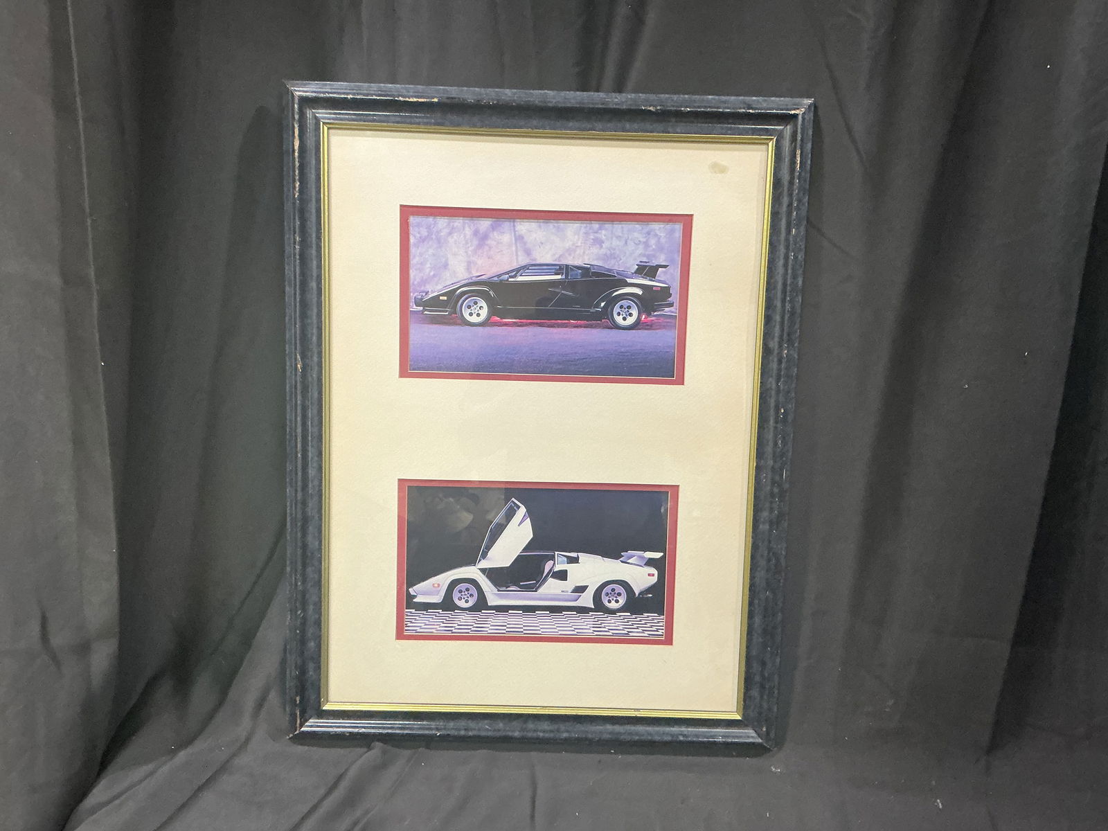 Framed Pair of Lamborghini Countach Photographic Prints Black & White with Scissor Doors: Stylish late-20th-century decorative display featuring two color photographs of the iconic Lamborghini Countach: top image shows a black example in dramatic three-quarter profile bottom image
