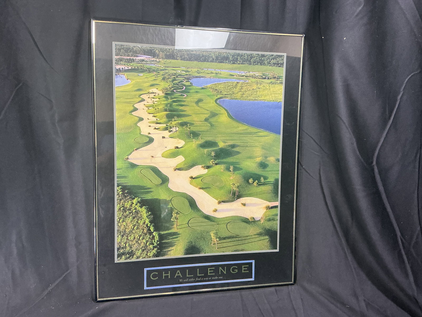 Challenge Motivational Golf Poster Aerial View of Tropical Course (Successories-style): Striking aerial photograph of a lush palm-lined golf course with winding fairways, white sand traps and sparkling blue water hazards. Bold lettering reads CHALLENGE with the caption We will either