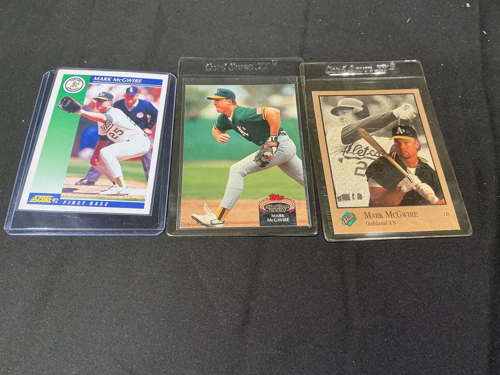 Mark McGwire Oakland Athletics Baseball Card Lot 3 Cards Topps Stadium Club Score: Group of three vintage Mark McGwire baseball cards featuring the Oakland Athletics. Includes Topps Stadium Club, Score, and classic early career issues. Power hitter and key figure of the late 1980s a