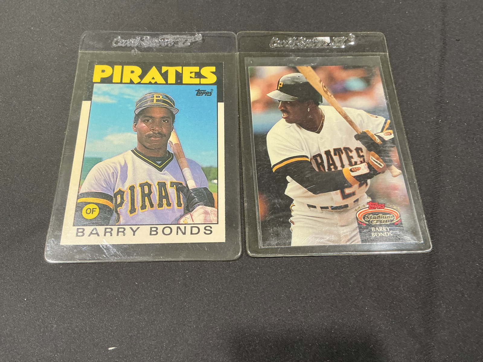 Barry Bonds Pittsburgh Pirates Baseball Card Lot 2 Cards Topps Stadium Club: Group of two vintage Barry Bonds baseball cards featuring his early Pittsburgh Pirates career. Includes Topps and Stadium Club issues showcasing one of the most dominant hitters in MLB history. Strong