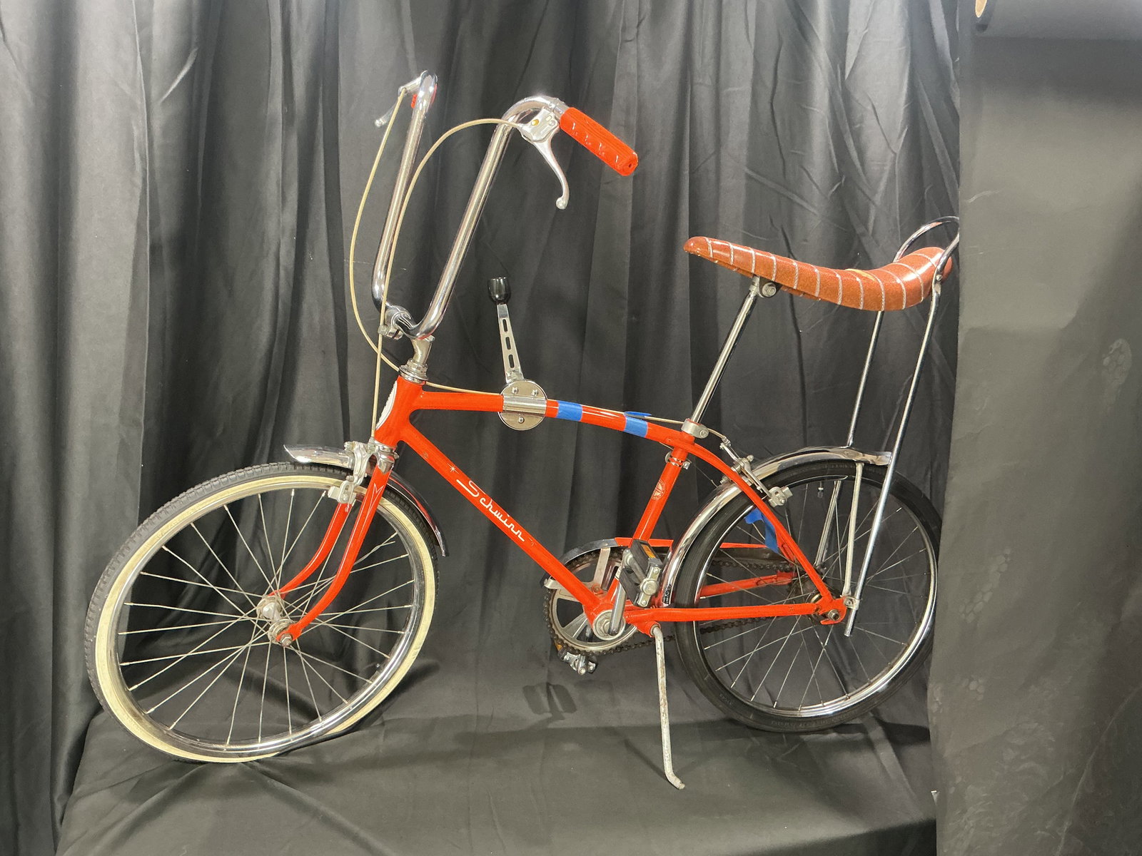 Vintage Schwinn Sting-Ray 3 speed Fastback Bicycle: A classic Schwinn Sting-Ray Fastback bicycle, an enduring symbol of American mid-century design and one of the most recognizable youth models of the late 1960s-early 1970s. Finished in bright orange w