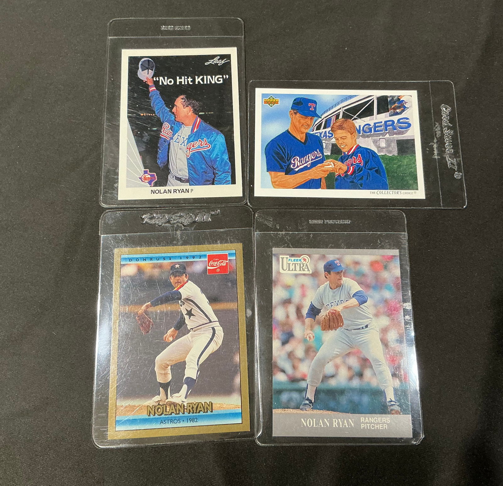 Nolan Ryan Texas Rangers Astros Baseball Card Lot 4 Cards Fleer Donruss Leaf Upper Deck: Group of four Nolan Ryan baseball cards featuring the legendary Hall of Fame pitcher with the Texas Rangers and Houston Astros. Includes Fleer Ultra, Donruss Coca-Cola issue, Leaf 'No Hit King' themed