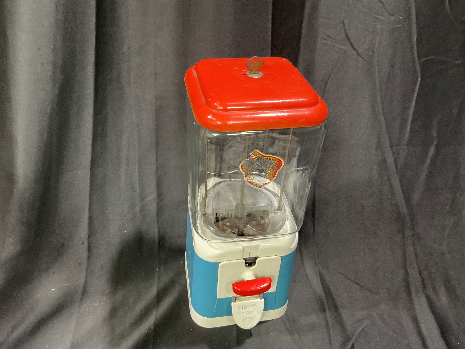 Vintage Northwestern Gumball Machine Red White and Blue Globe Coin-Op: Vintage coin-operated gumball machine with red white and blue globe and metal base. Classic Northwestern style with strong nostalgic appeal. Fully functional with intact glass globe with faded logo.