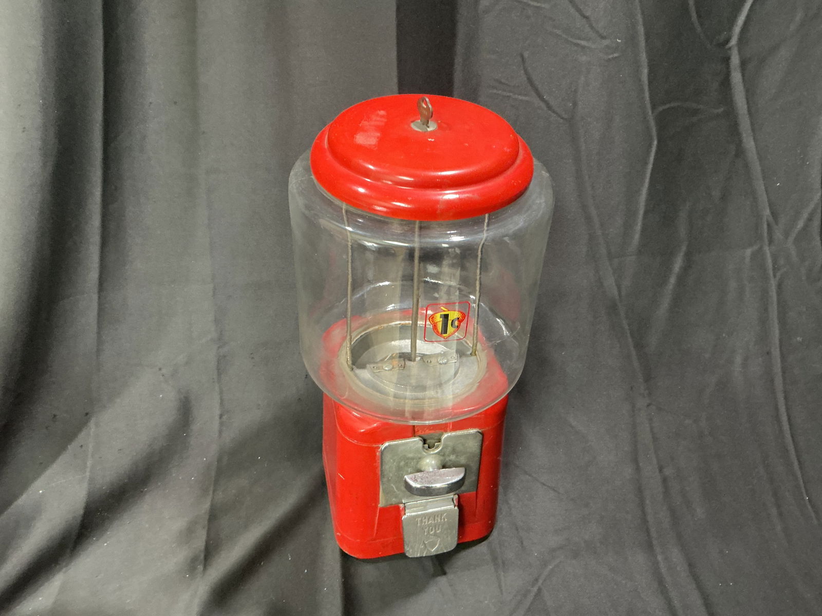 Vintage Northwestern Gumball Machine Red Globe Coin-Op Original Decal: Vintage coin-operated gumball machine with classic red globe and metal body. Features original decal still in good condition. Fully functional with intact glass globe and strong display appeal.