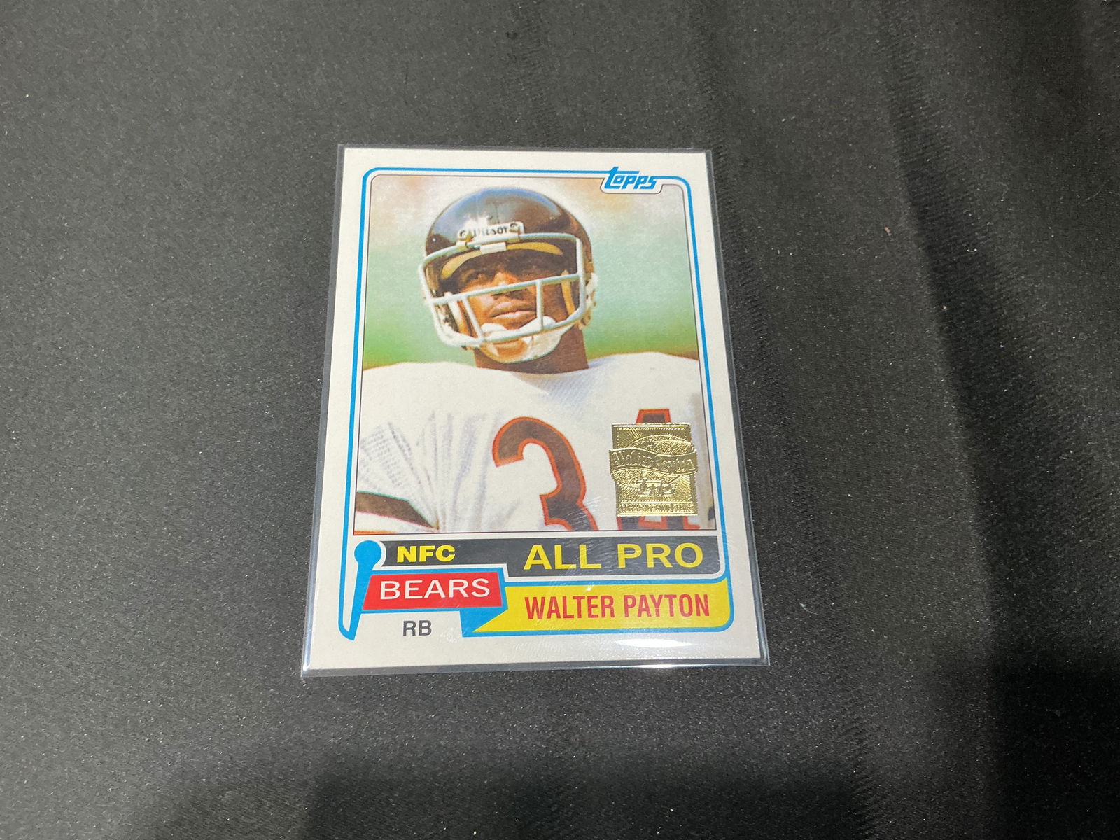 Walter Payton Topps All Pro Football Card Reprint Gold Stamp: Topps Walter Payton All Pro football card featuring the legendary Chicago Bears running back. Gold stamp edition reprint with classic 1981 design. A strong display piece honoring one of the NFL's grea